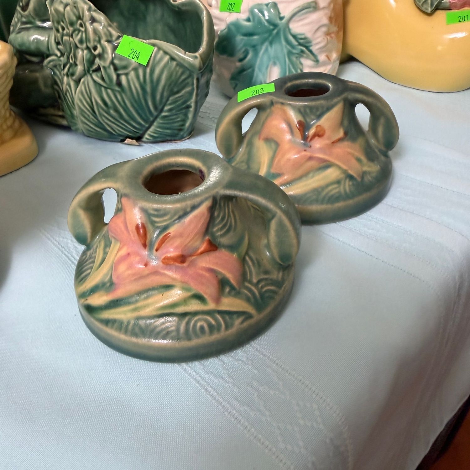 Lot #203, pair of Roseville pottery zephyr lily candlesticks, mold 1162, 2"