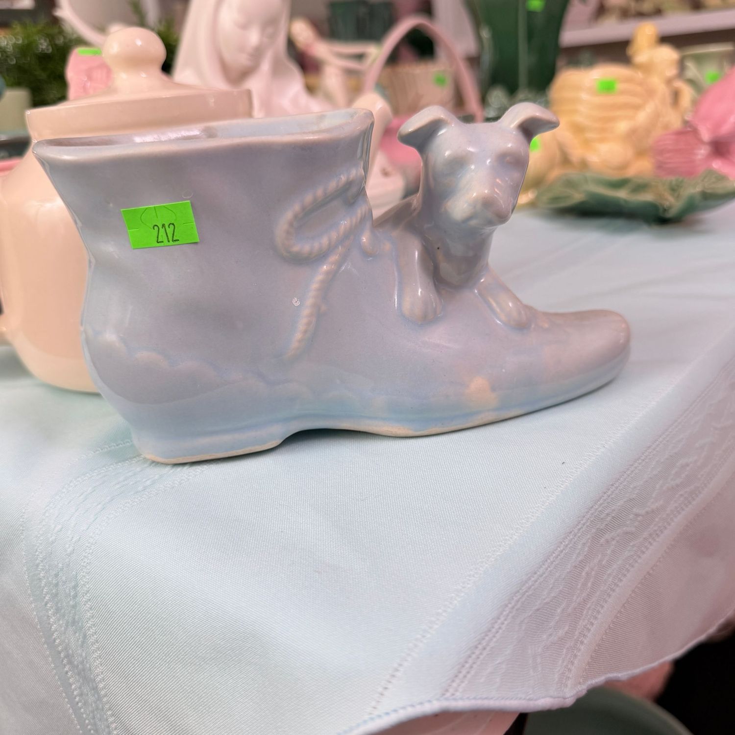Lot #212, Shawnee pottery light blue puppy with shoe planter, 7"L