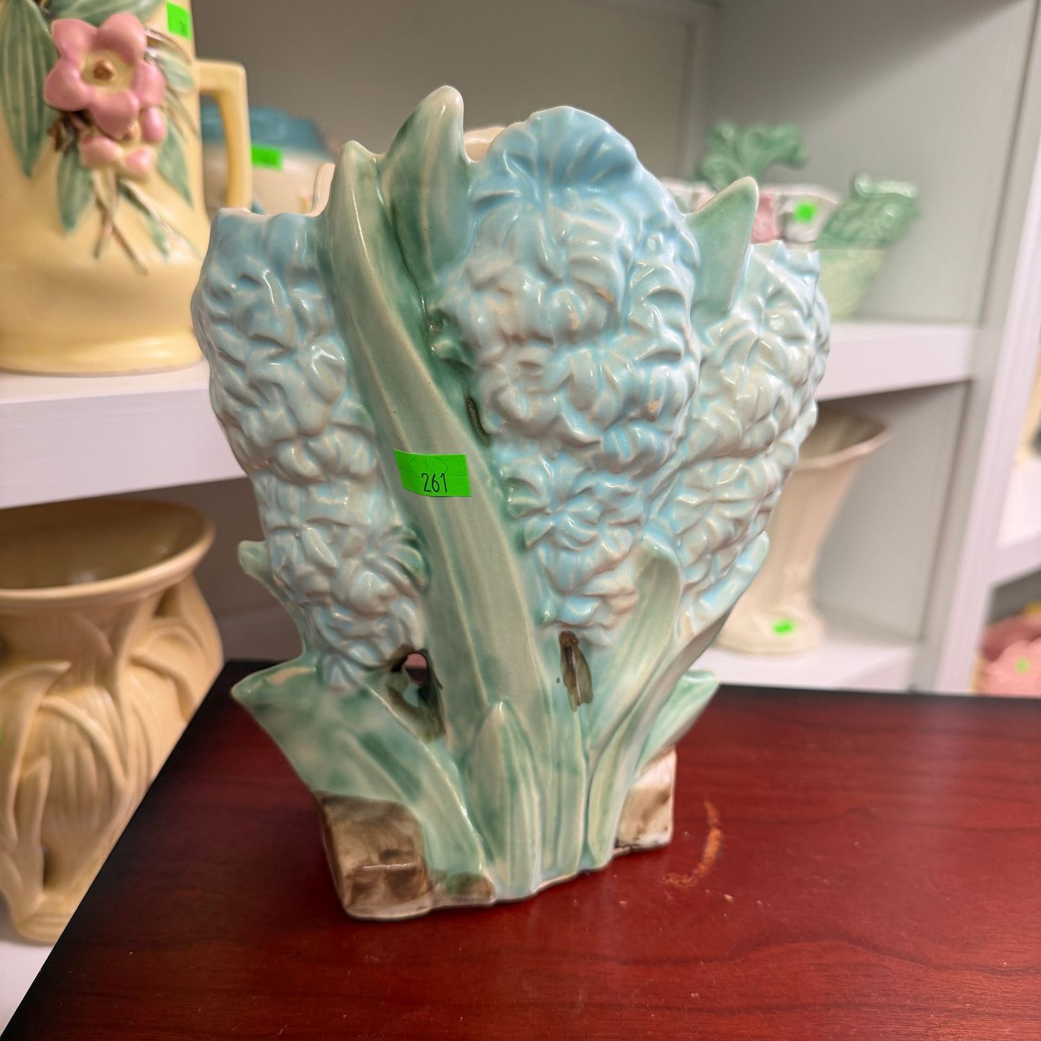 Lot #261, blue hyacinth McCoy pottery vase, minor chip inside rim, 7"