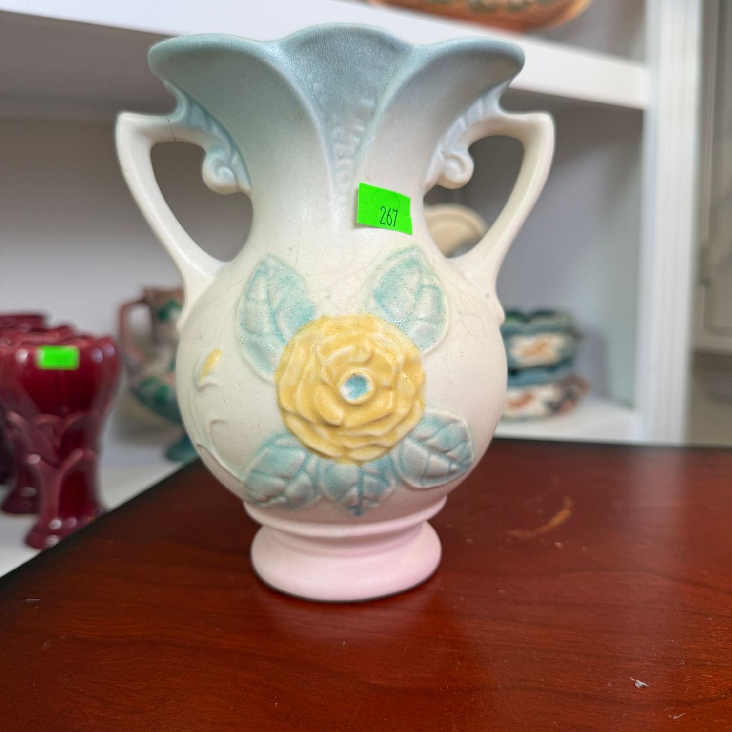 Lot #267, Hull pottery Camelia, rose, angled handle vase, 6 1/4"