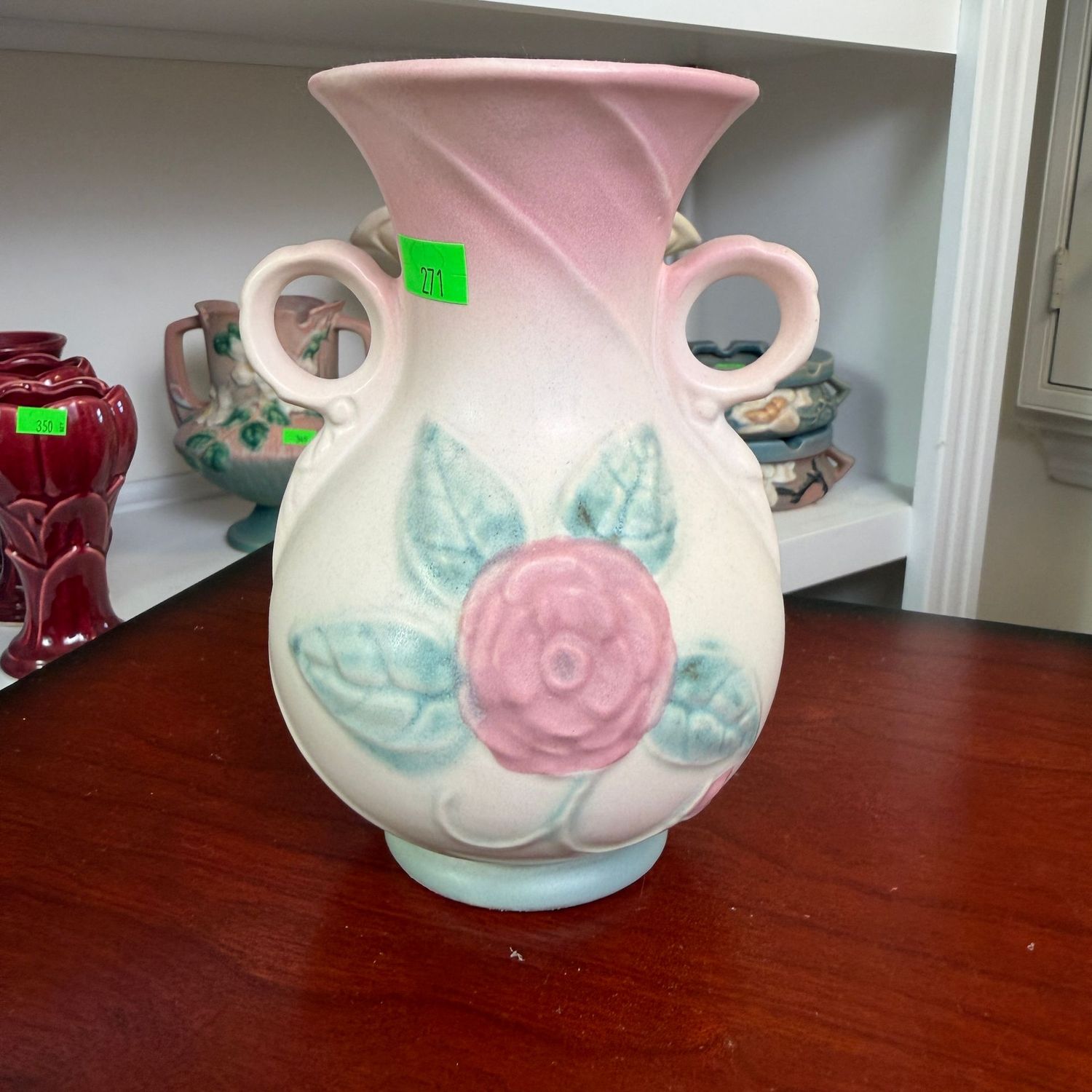 Lot #271, Hull pottery, open rose, loop handle vase, 6 1/4"