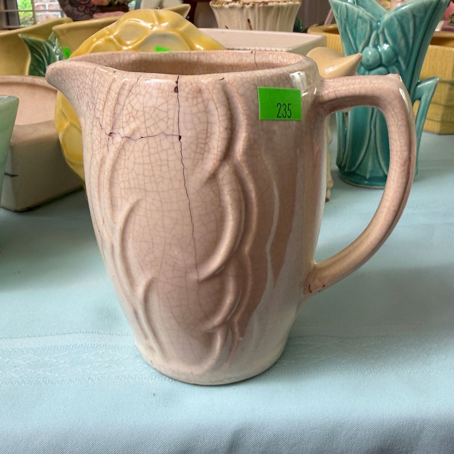 Lot #235, vintage McCoy pottery pitcher, some hairlines and crazing, 4.5"