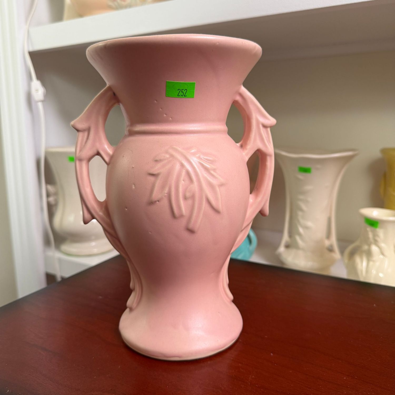 Lot #252, pink McCoy pottery, embossed, branch-handle vase, 8"