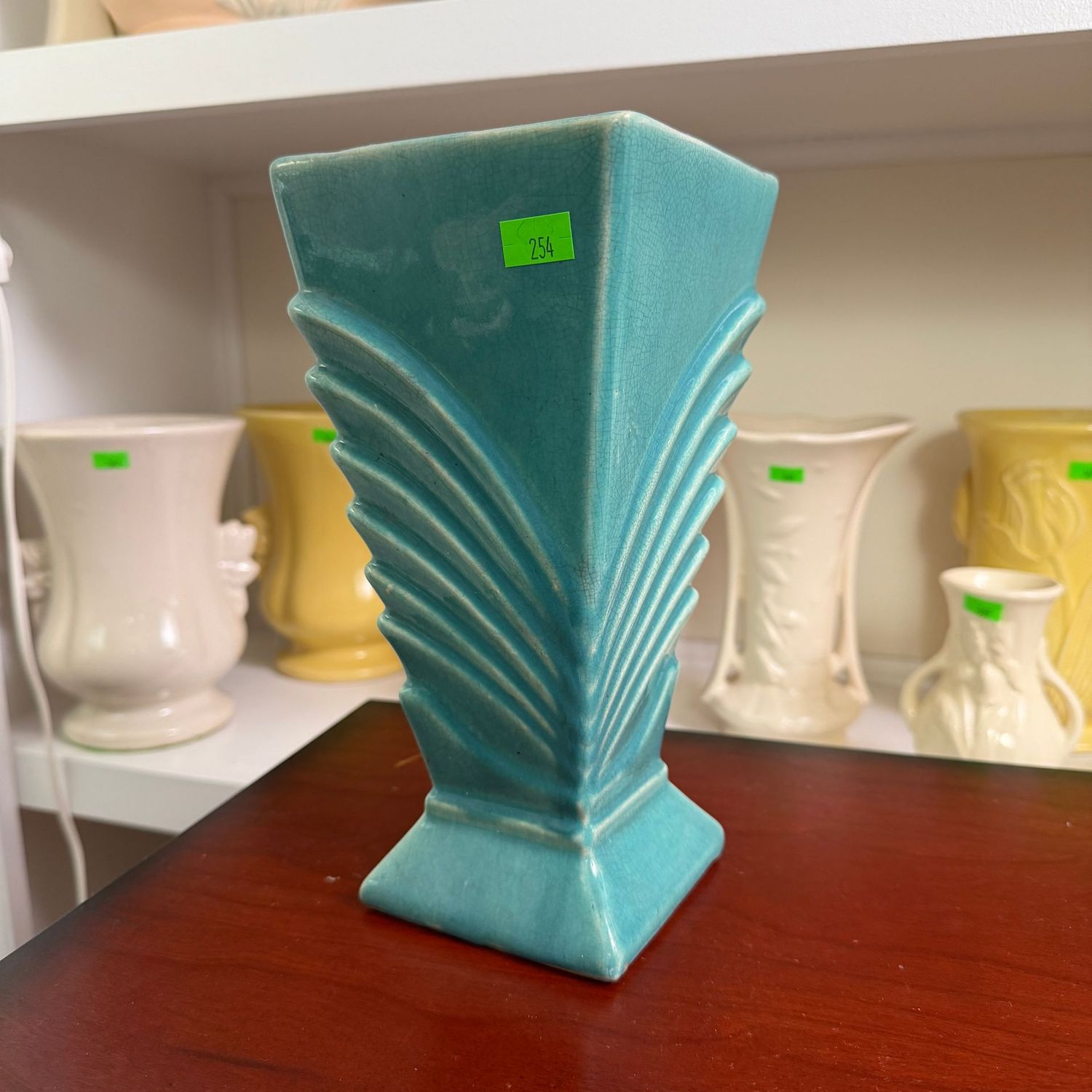 Lot #254, teal early McCoy pottery deco vase, long hairline, 8 Lot #254, teal early McCoy pottery deco vase, long hairline, 8"