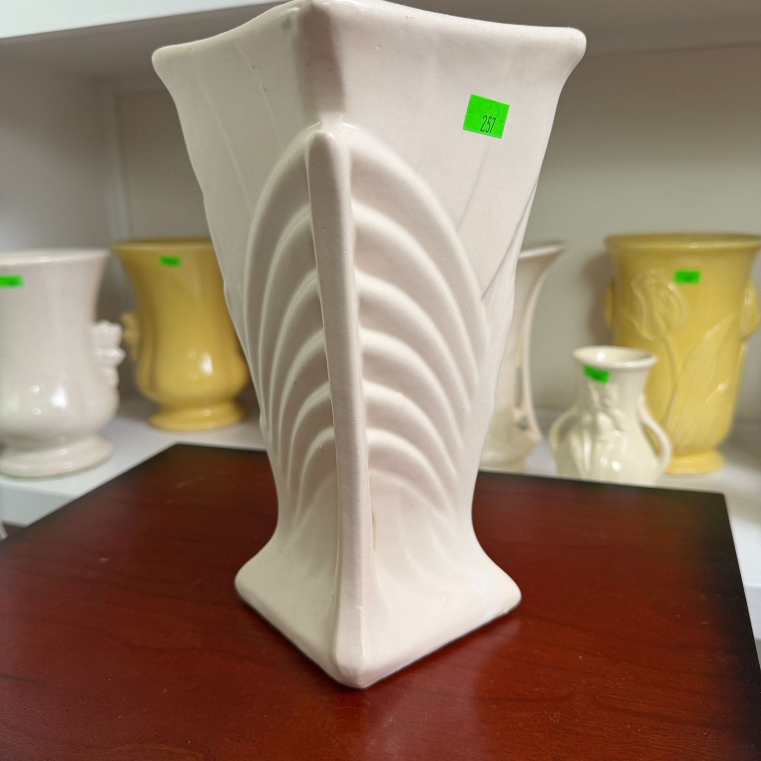 Lot #257, McCoy pottery ivory feathered grass, fan, vase, minor hairline, 8 Lot #257, McCoy pottery ivory feathered grass, fan, vase, minor hairline, 8"
