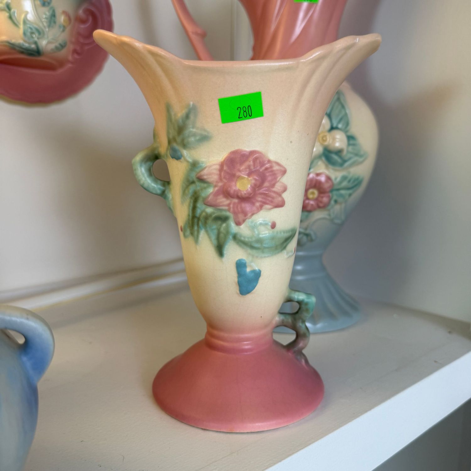 Lot #280, Hull Pottery Woodland vase, has a repaired crack near top, 7 1/4 Lot #280, Hull Pottery Woodland vase, has a repaired crack near top, 7 1/4"