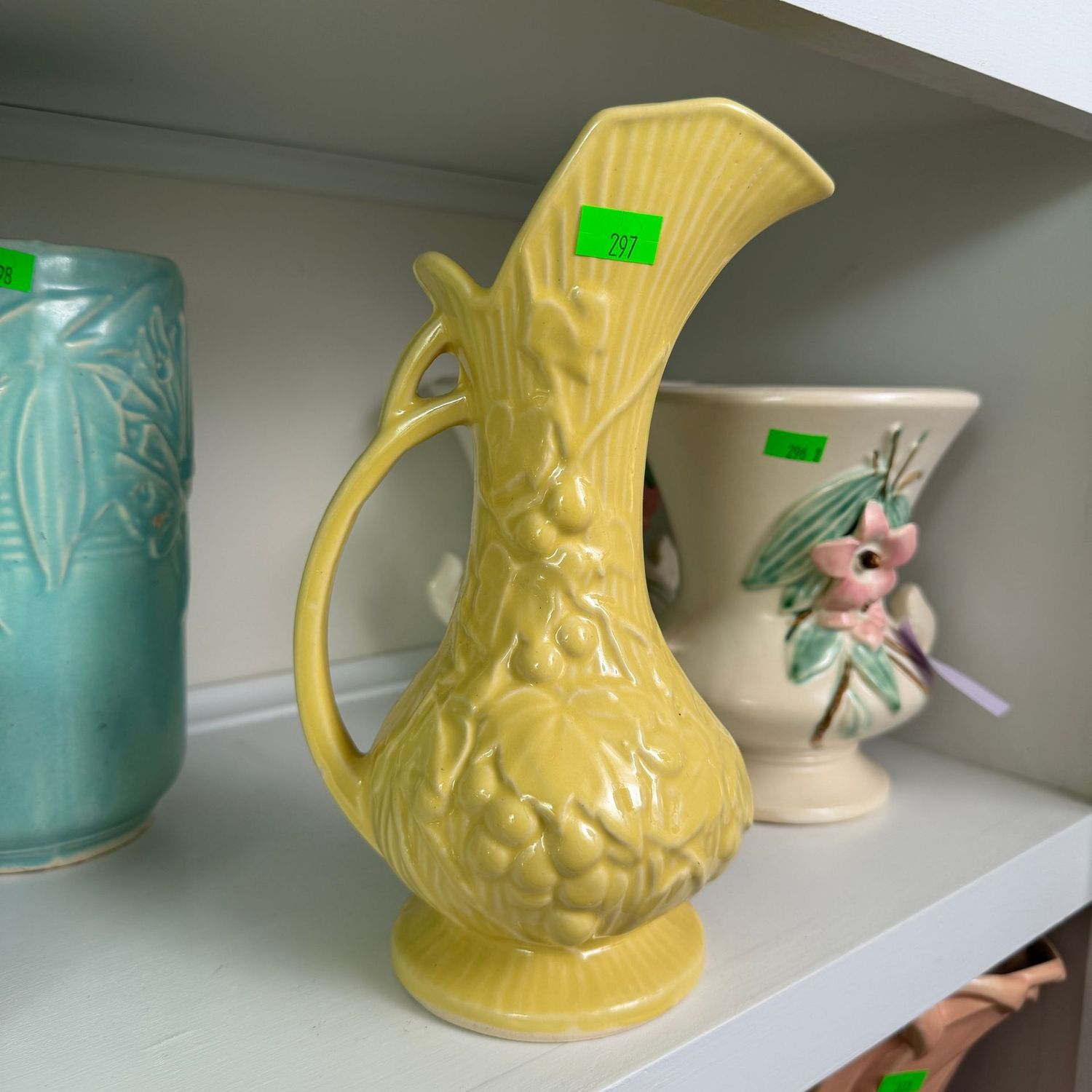 Lot #297, yellow McCoy grapes pattern pitcher, ewer, 8 Lot #297, yellow McCoy grapes pattern pitcher, ewer, 8"