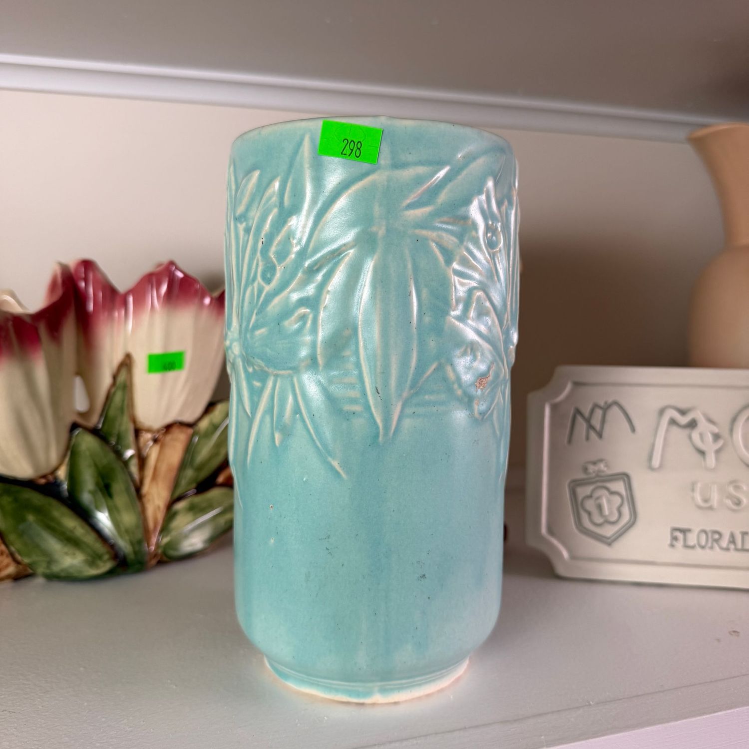Lot #298, Nelson McCoy pottery blue butterfly cylindrical vase, 7"