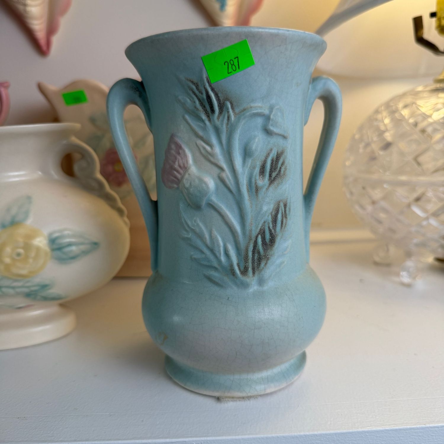Lot #287, Hull pottery thistle blue vase, 6 1/2 Lot #287, Hull pottery thistle blue vase, 6 1/2"