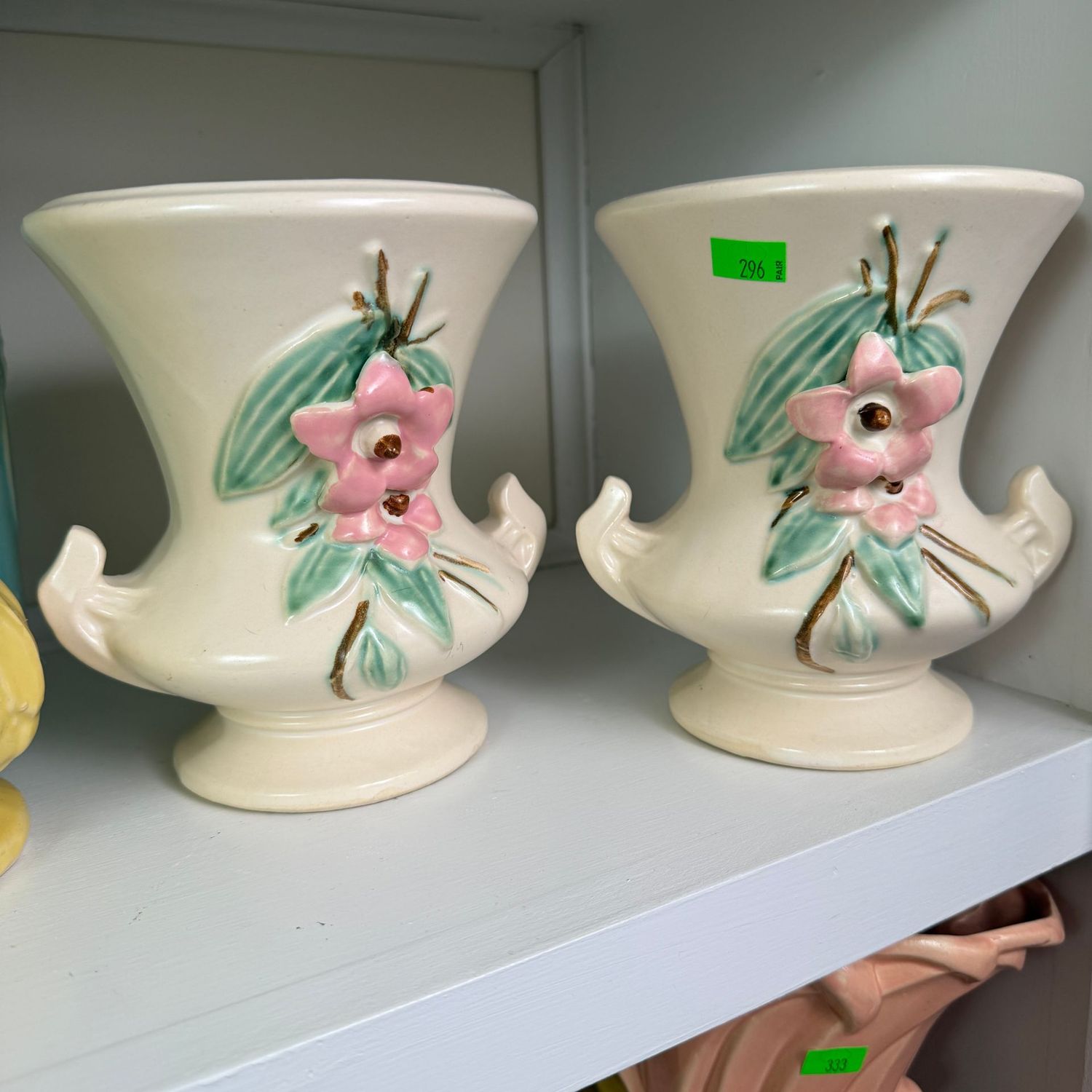 Lot #296, pair of McCoy pottery blossom time vases, one has a hairline, 5.5"