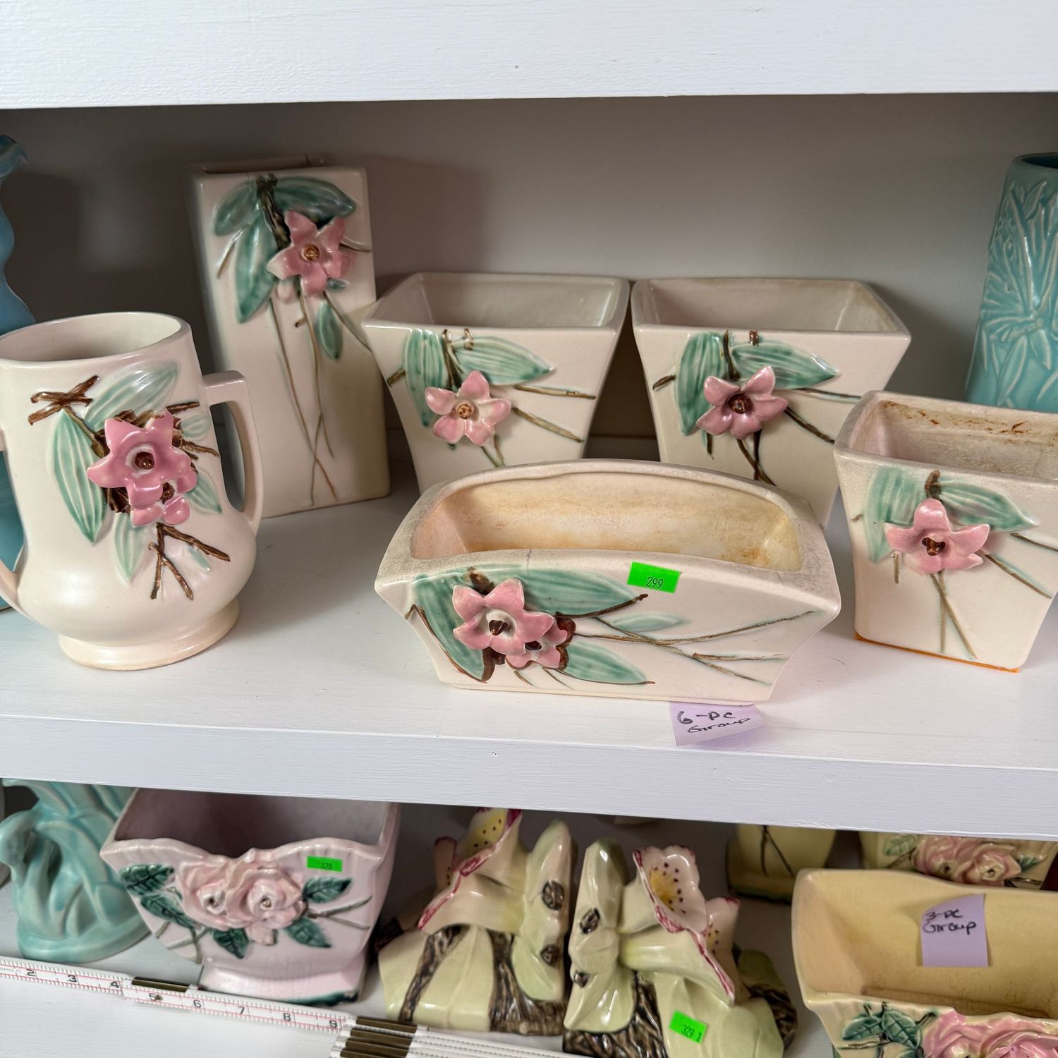 Lot #299, group of 6 McCoy pottery blossom time planters, variety of sizes, some have minor chips and hairlines, the tallest is 7"