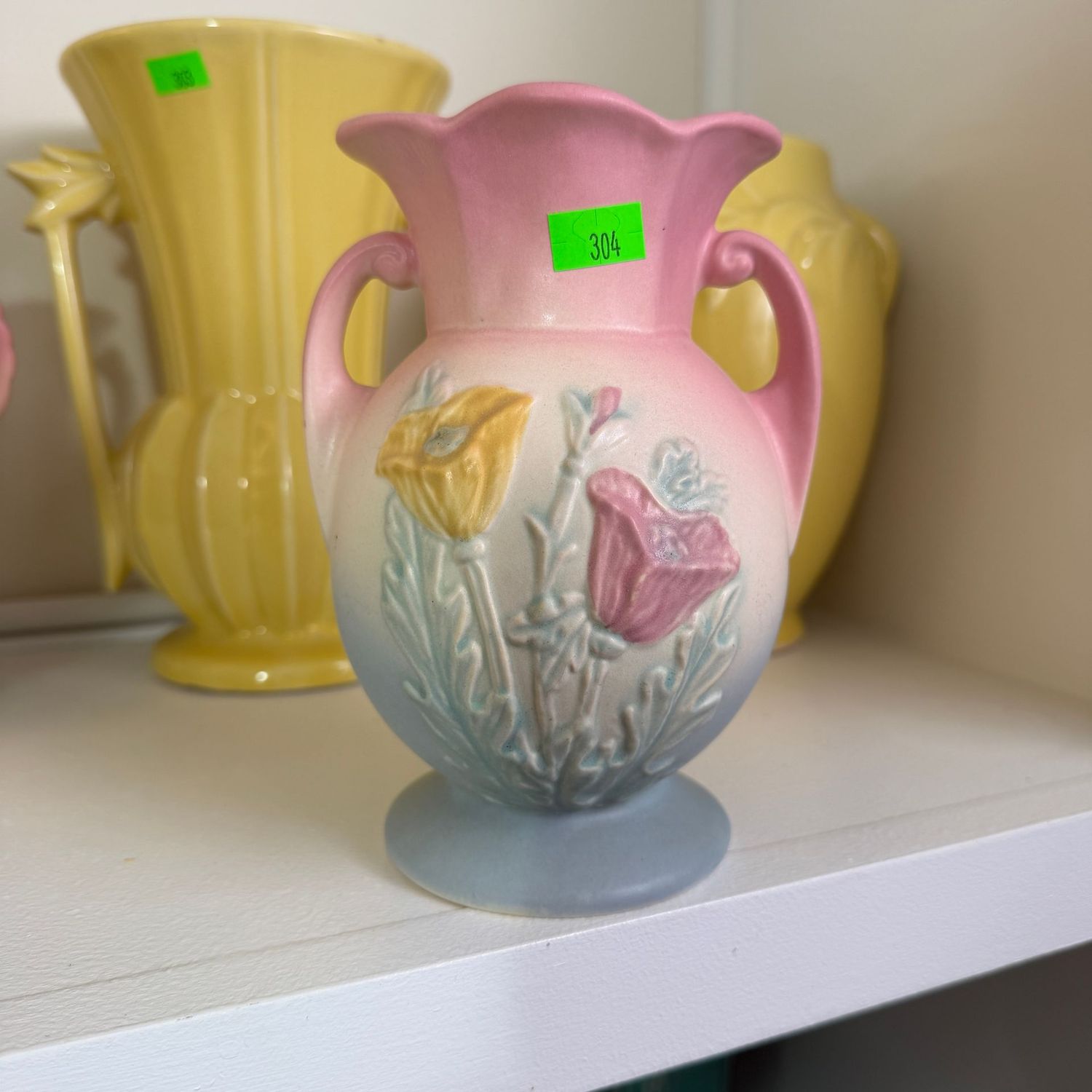 Lot #304, Hull pottery poppy vase, chip near top, 6 1/2"