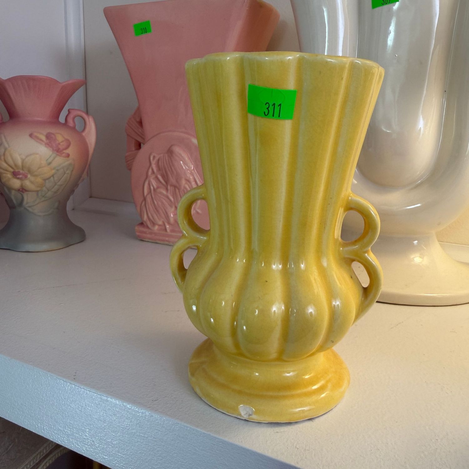Lot #311, vintage McCoy yellow pottery vase, loop handles, minor chip on foot, small hairlines, 5"