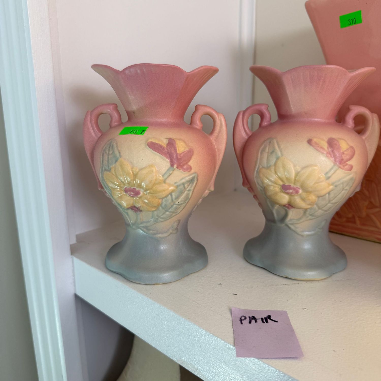 Lot #312, pair of Hull pottery magnolia vases, one has chips on back, 6 1/4 Lot #312, pair of Hull pottery magnolia vases, one has chips on back, 6 1/4"