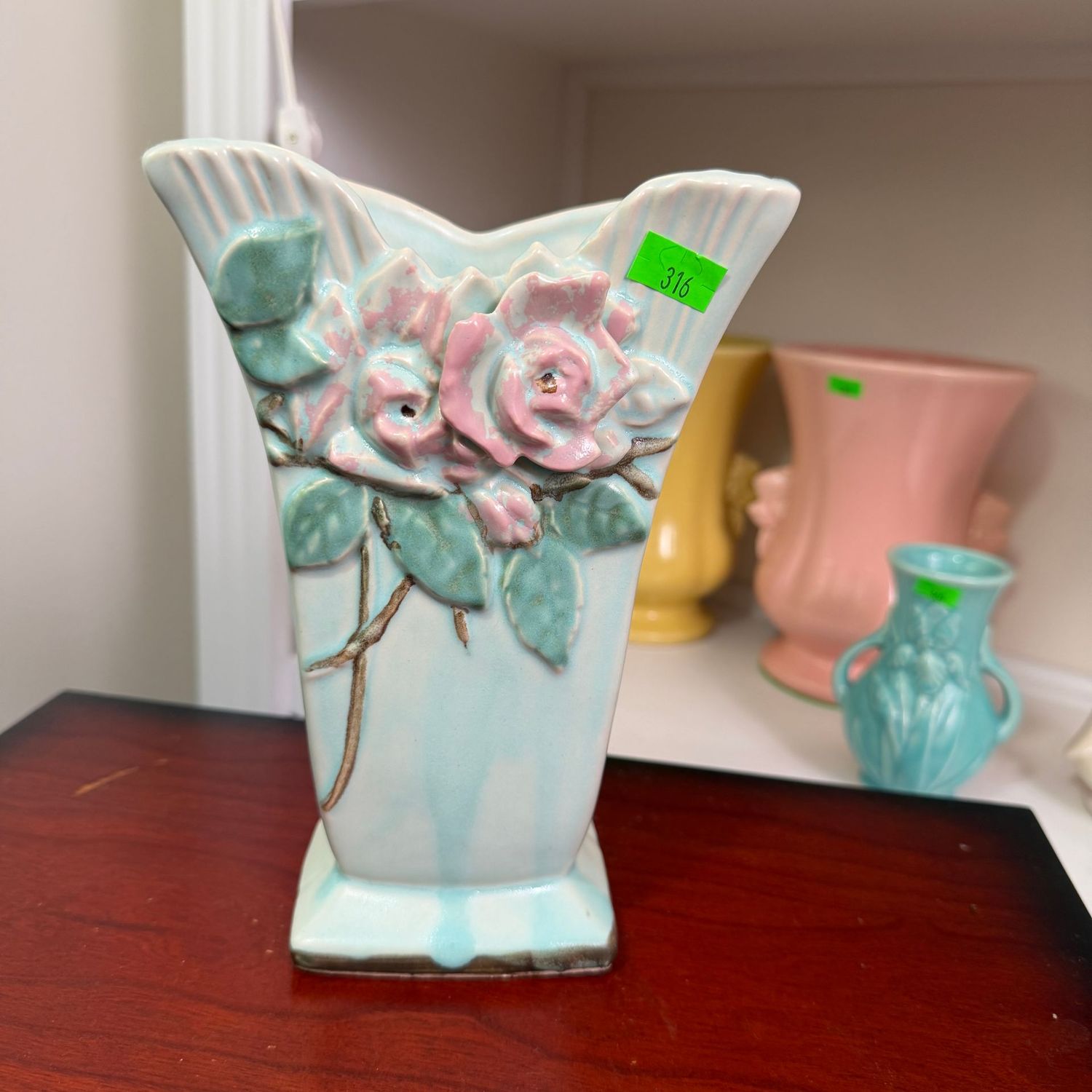 Lot #316, McCoy pottery blue wild rose vase, 6.5"