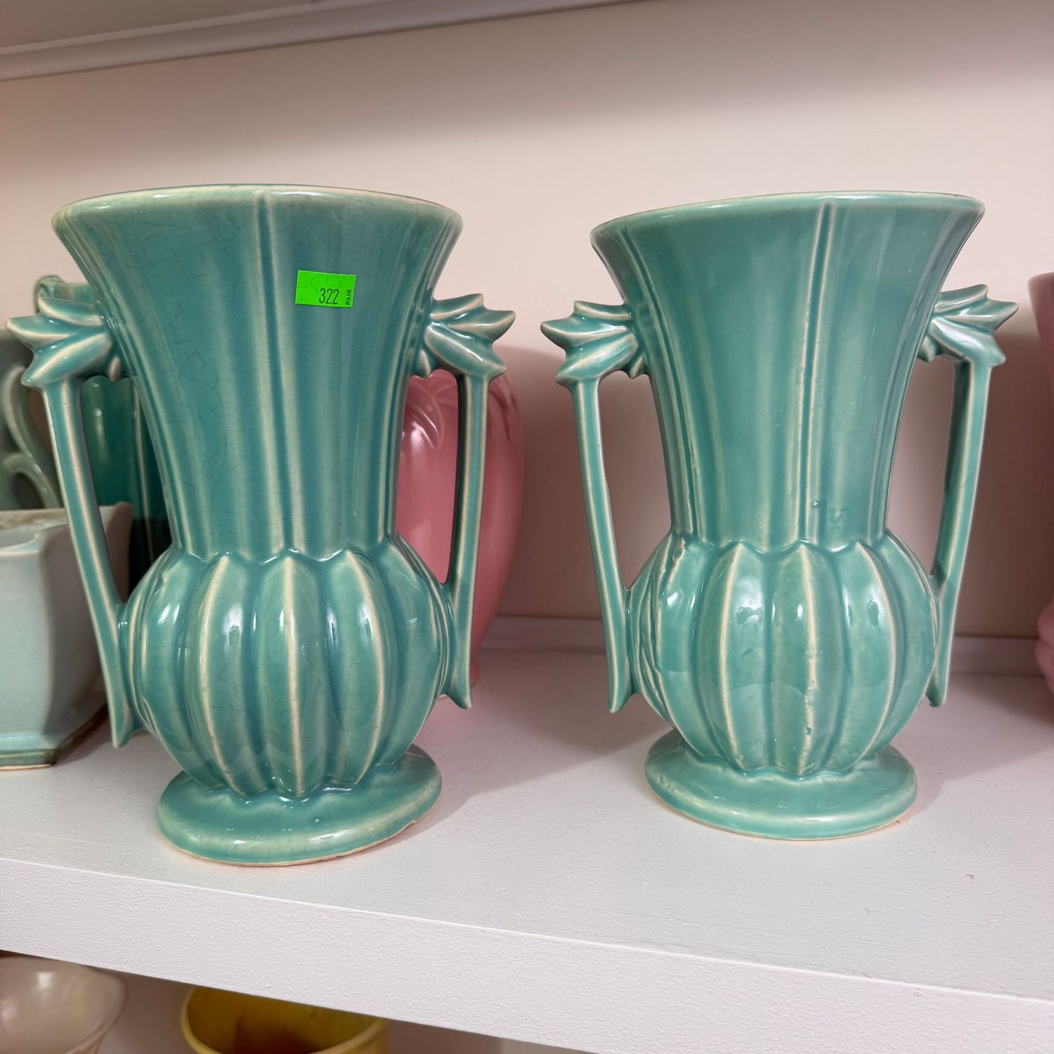 Lot #322, pair of teal McCoy pottery vases, double-handle, 7.5"