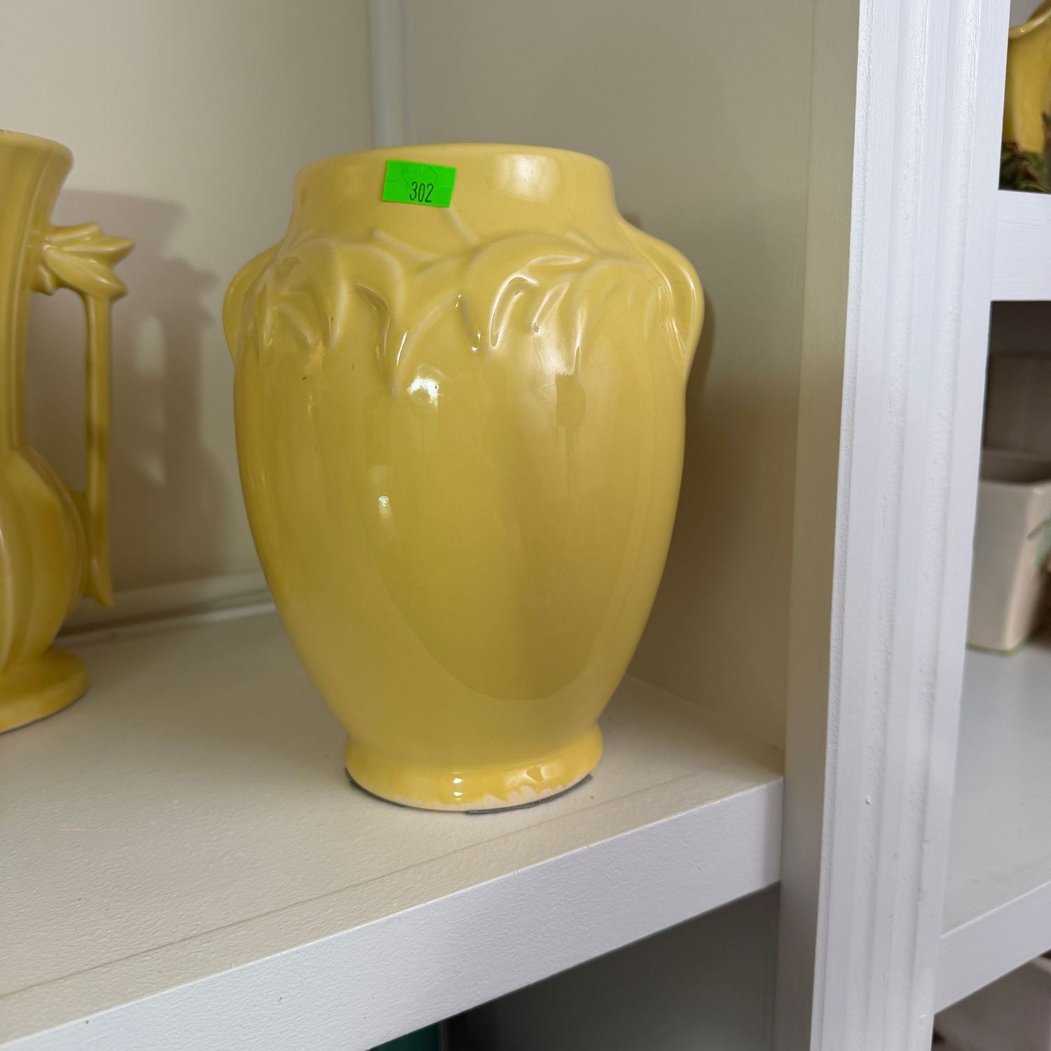 Lot #302, McCoy pottery yellow vase with leafy border, 7 Lot #302, McCoy pottery yellow vase with leafy border, 7"