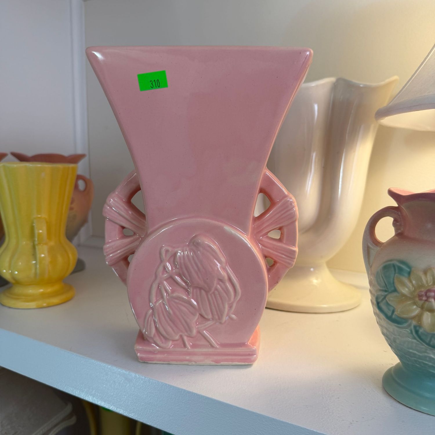 Lot #310, pink McCoy pottery embossed floral vase with wheel handles, 8 Lot #310, pink McCoy pottery embossed floral vase with wheel handles, 8"