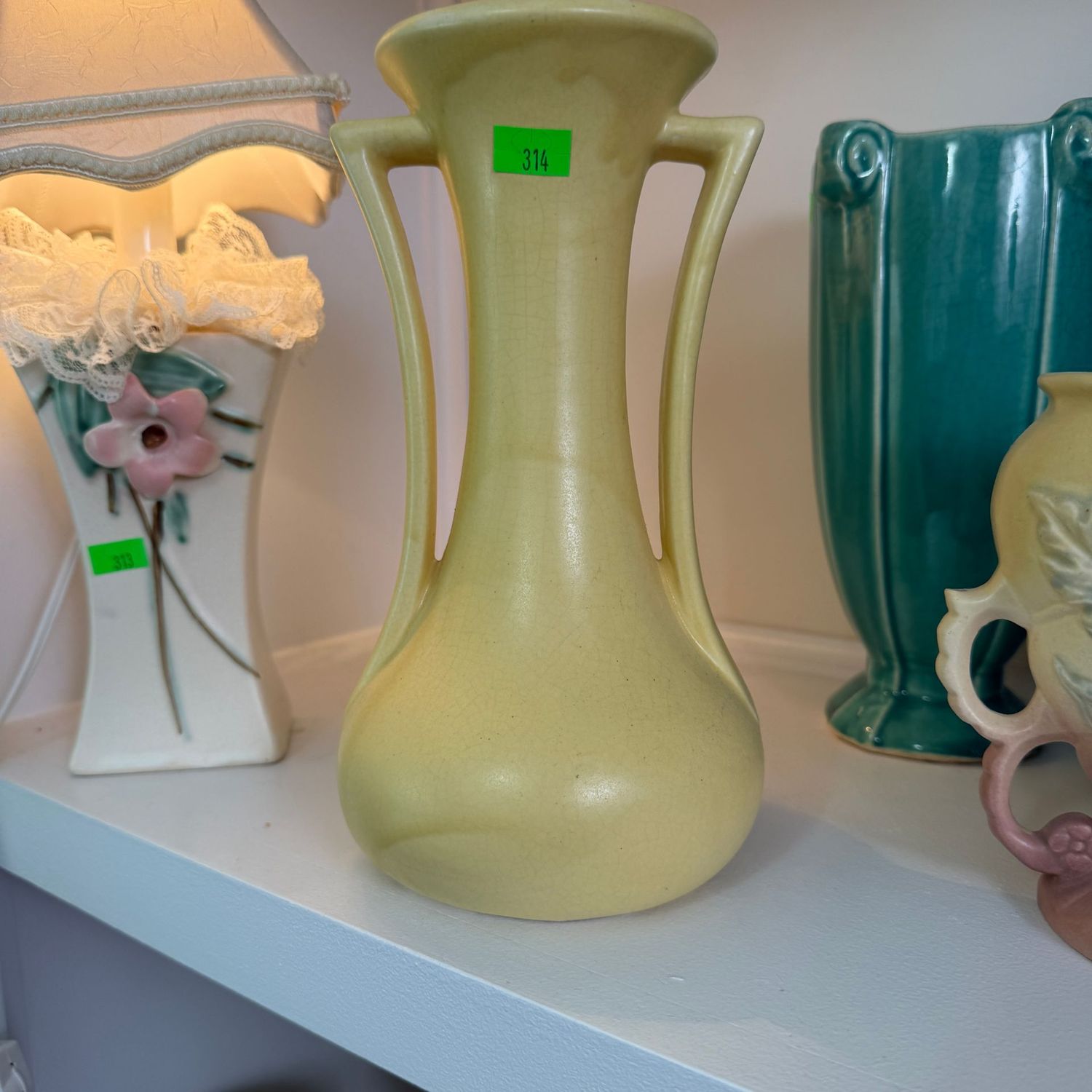 Lot #314, yellow pottery slender double-handle vase, 8 Lot #314, yellow pottery slender double-handle vase, 8"