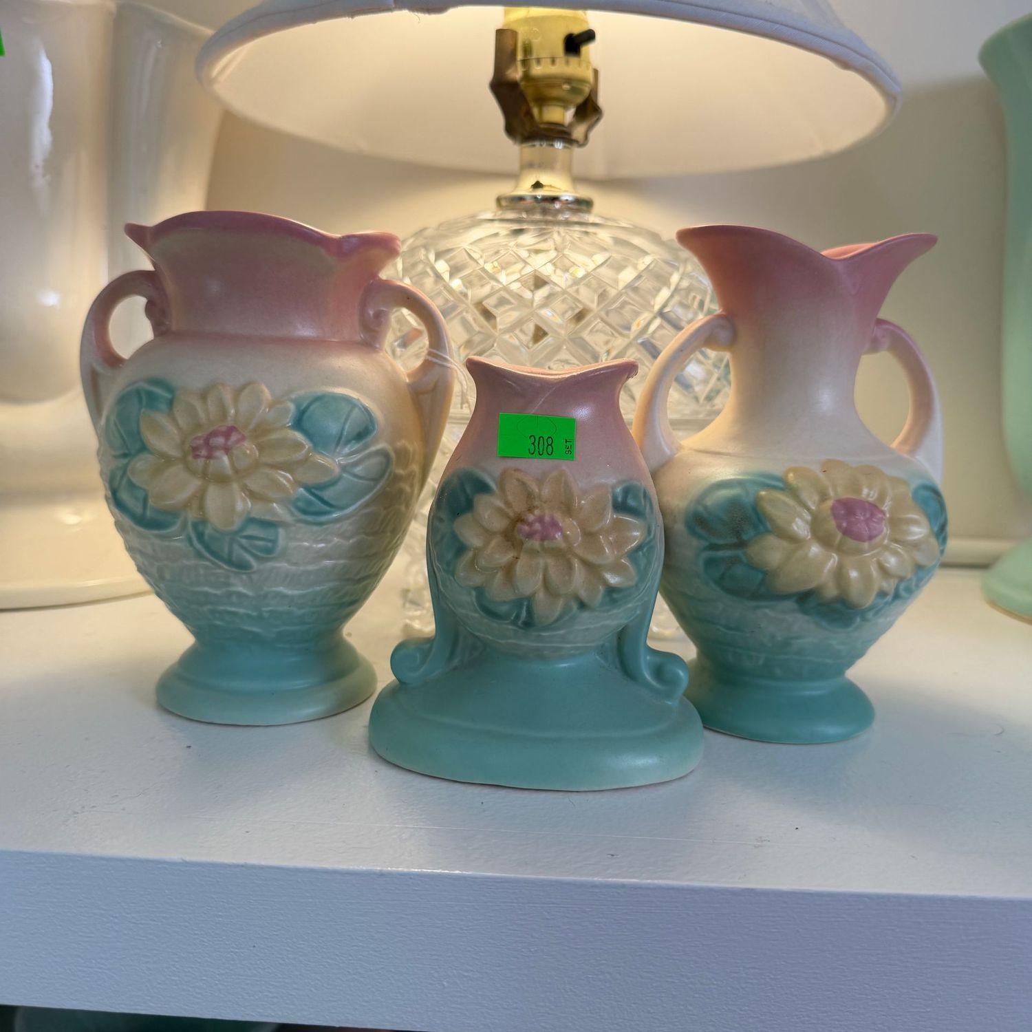 Lot #308, set of Hull pottery water lily vases and candle holder, tallest is 5 1/2"