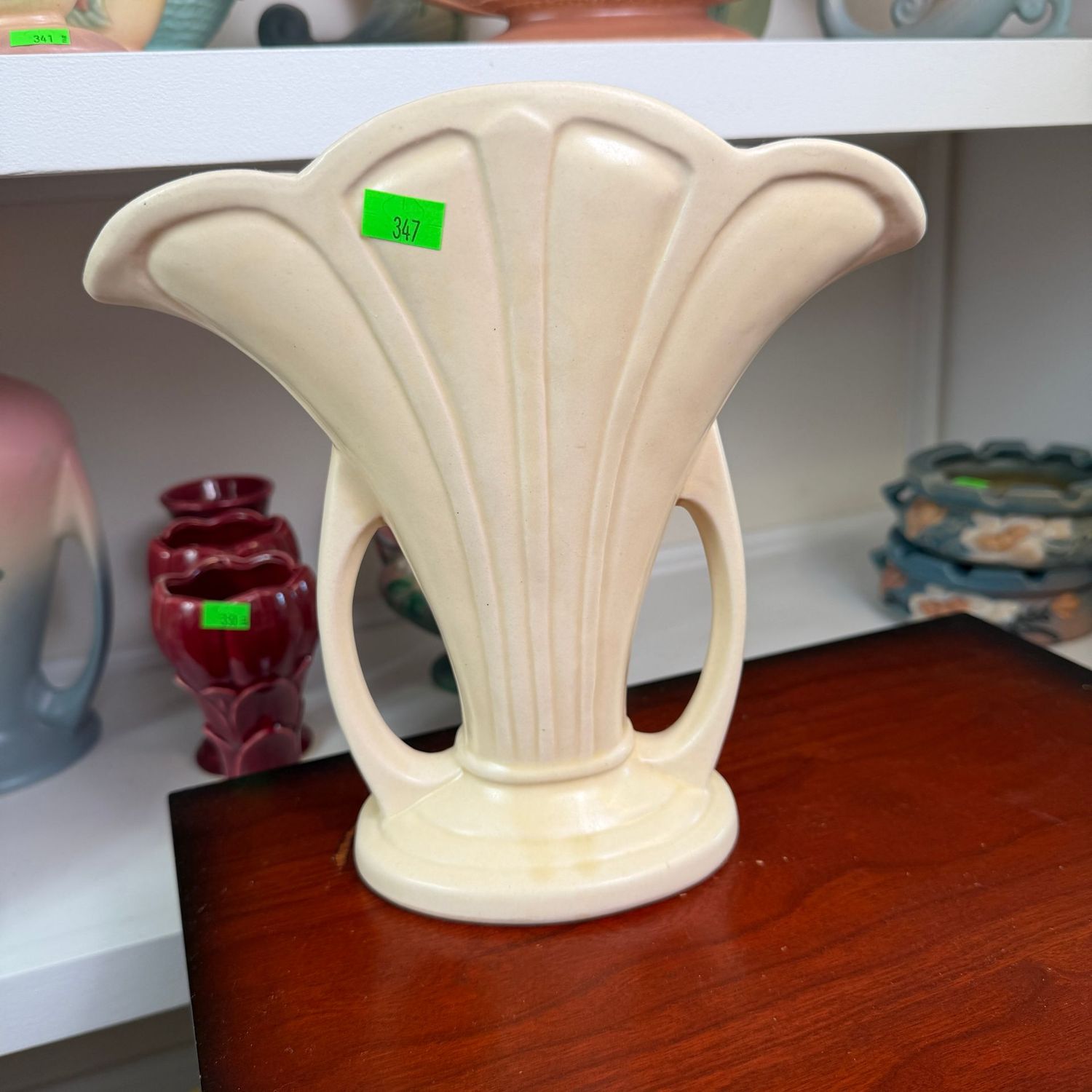Lot #347, ivory Hull Granada pottery fan vase, 9 1/2"H