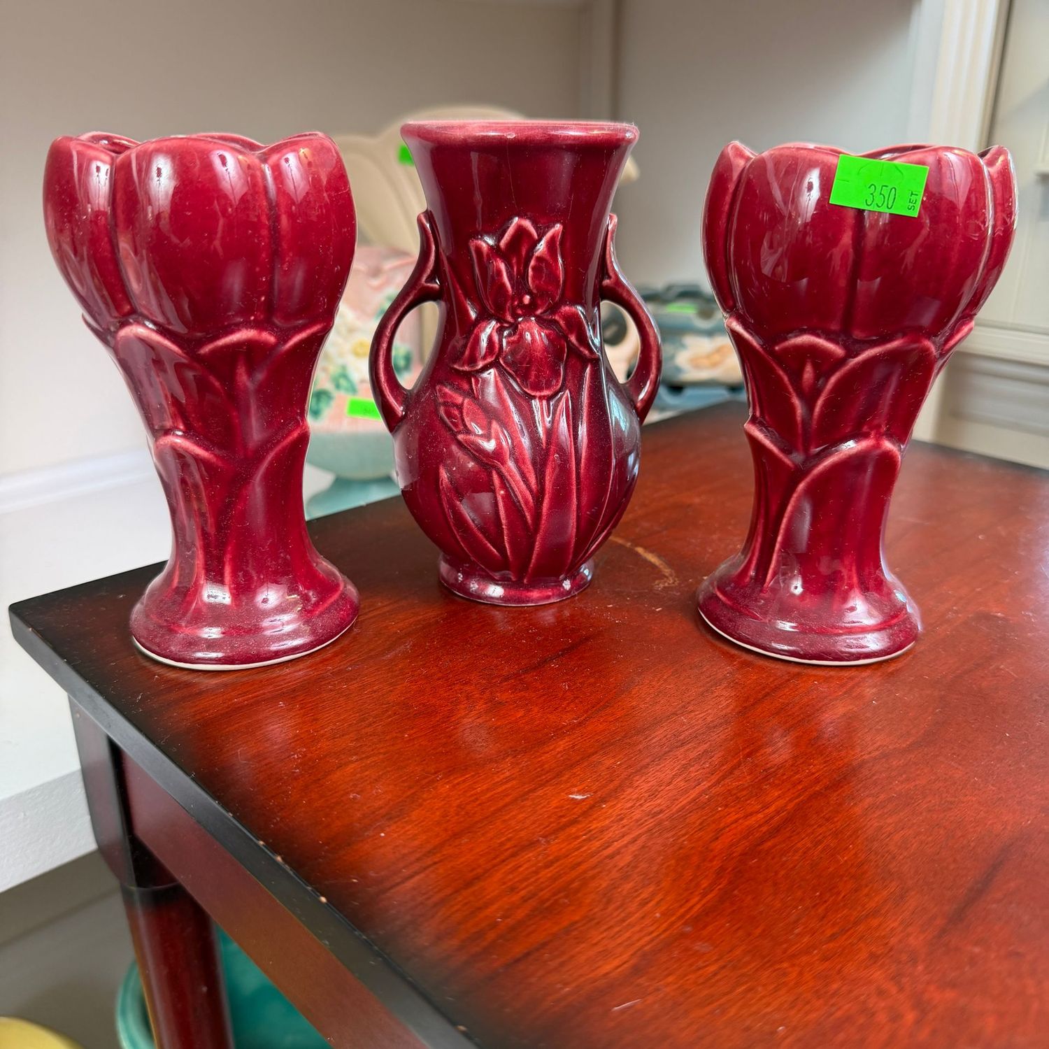 Lot #350, set of 3 Maroon, burgundy Shawnee pottery bud vases, 6 Lot #350, set of 3 Maroon, burgundy Shawnee pottery bud vases, 6"