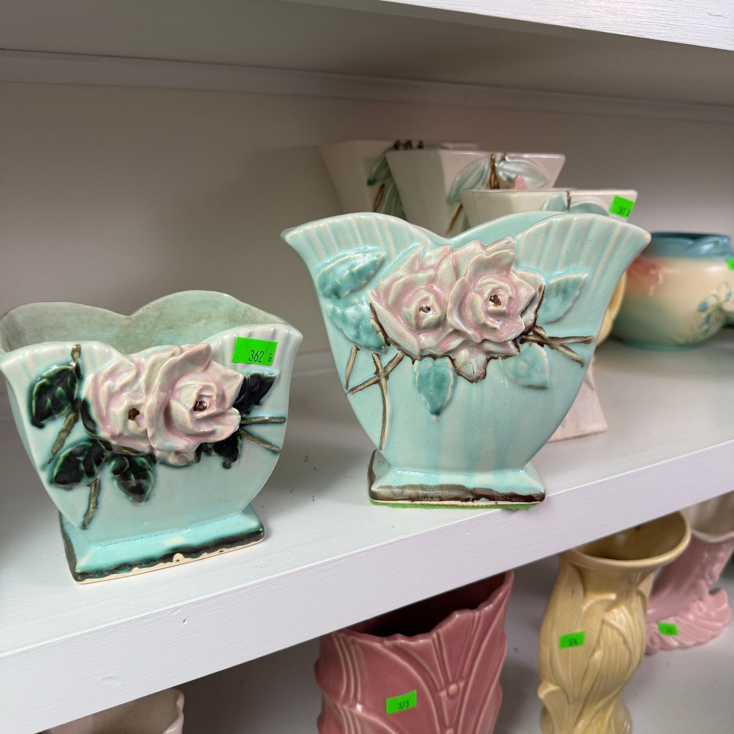 Lot #362, set of McCoy pottery wild rose planters, minor hairline & wear, the tallest is 6.5"H