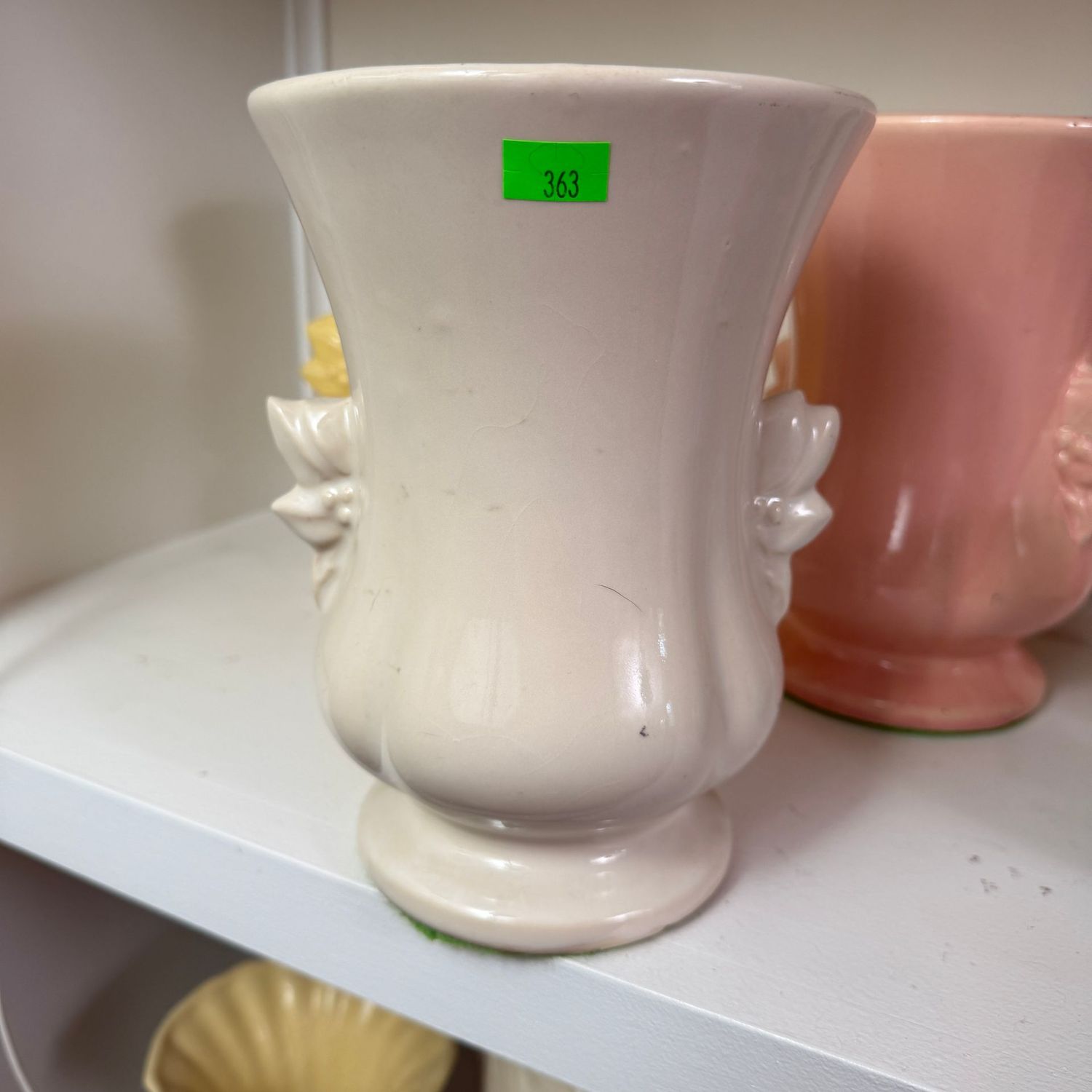 Lot #363(a), white pottery vase with leaf & berry handles, 8.5 Lot #363(a), white pottery vase with leaf & berry handles, 8.5"