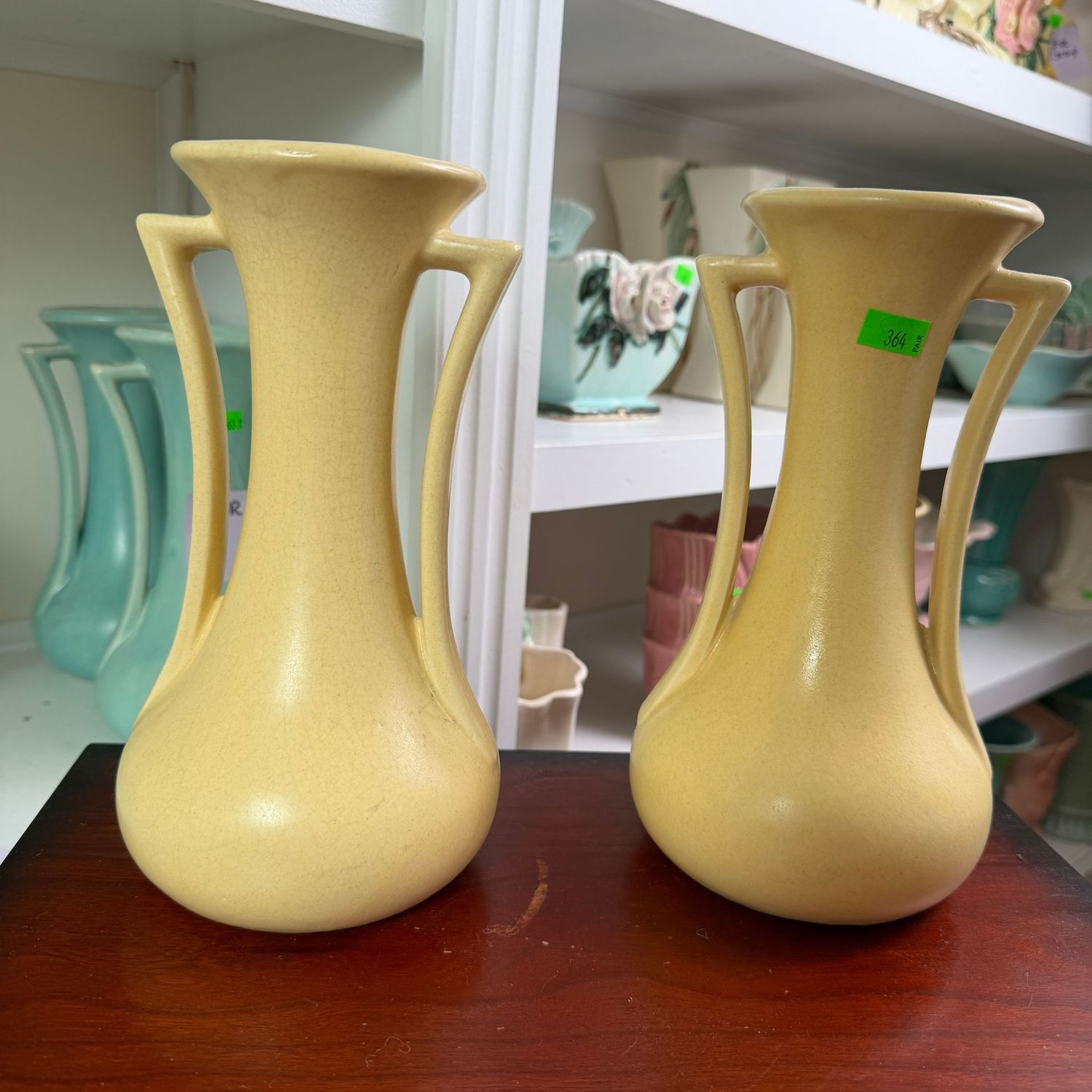 Lot #364, pair of yellow USA (McCoy) pottery vases, 9"H
