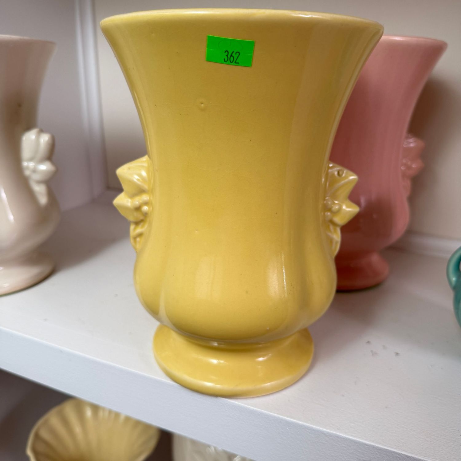 Lot #362(a), yellow pottery vase with leaf & berry handles, 8.5 Lot #362(a), yellow pottery vase with leaf & berry handles, 8.5"