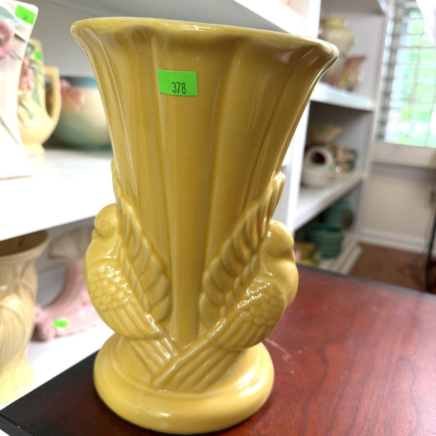 Lot #378, yellow Shawnee pottery dove vase, minor hairline, 9 Lot #378, yellow Shawnee pottery dove vase, minor hairline, 9"