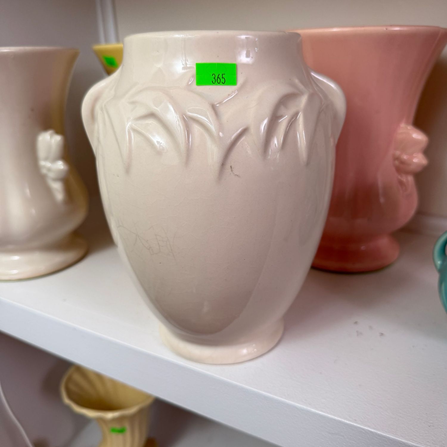 Lot #365(a), McCoy pottery ivory vase with leafy border, 8.5"