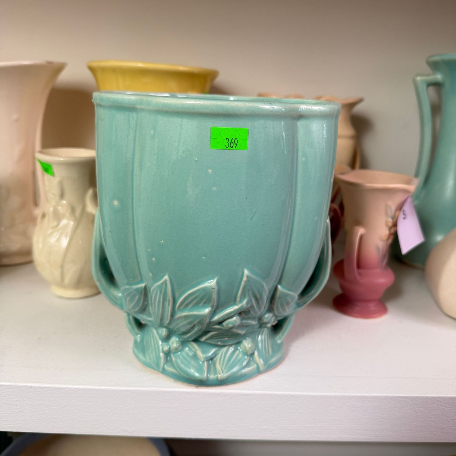 Lot #369(a) McCoy pottery teal planter, leaf and berry border, 7 1/4"