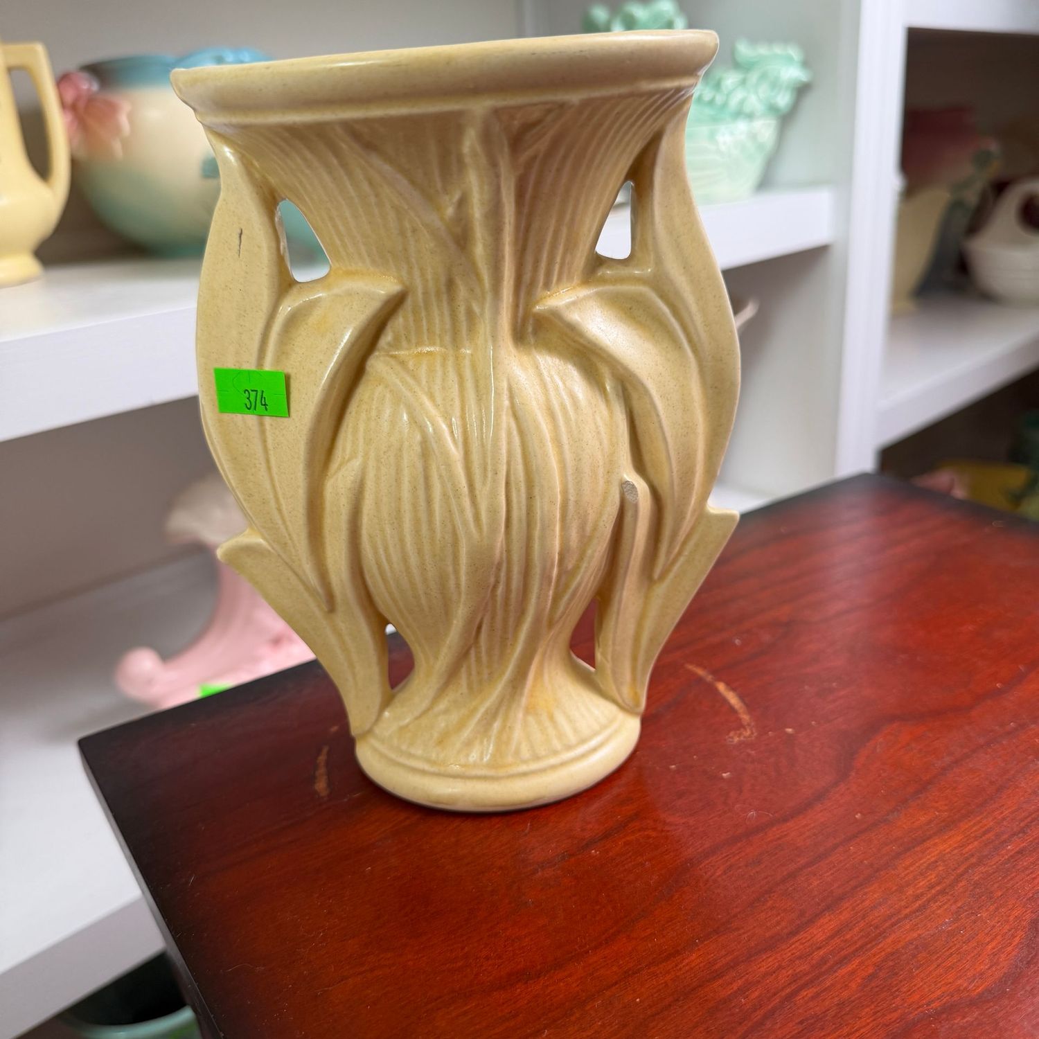 Lot #374, yellow pottery leaf vase, 7.5"H