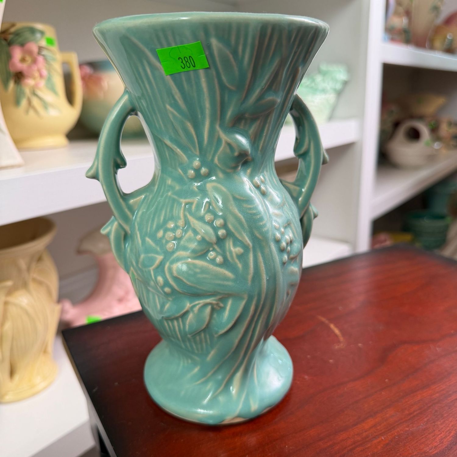 Lot #380, teal McCoy pottery bird of paradise vase, 8 Lot #380, teal McCoy pottery bird of paradise vase, 8"