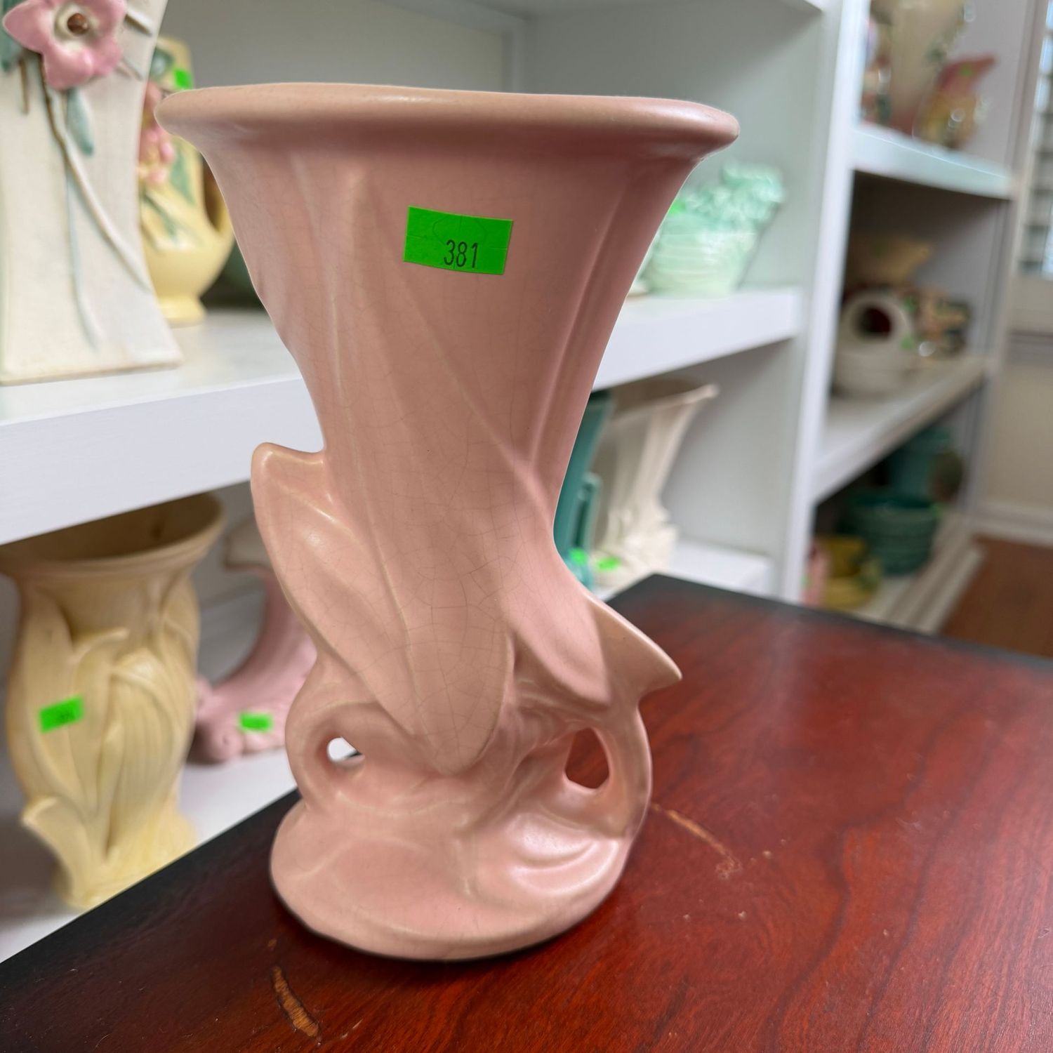 Lot #381, pink McCoy pottery tapered leaf vase, 8"
