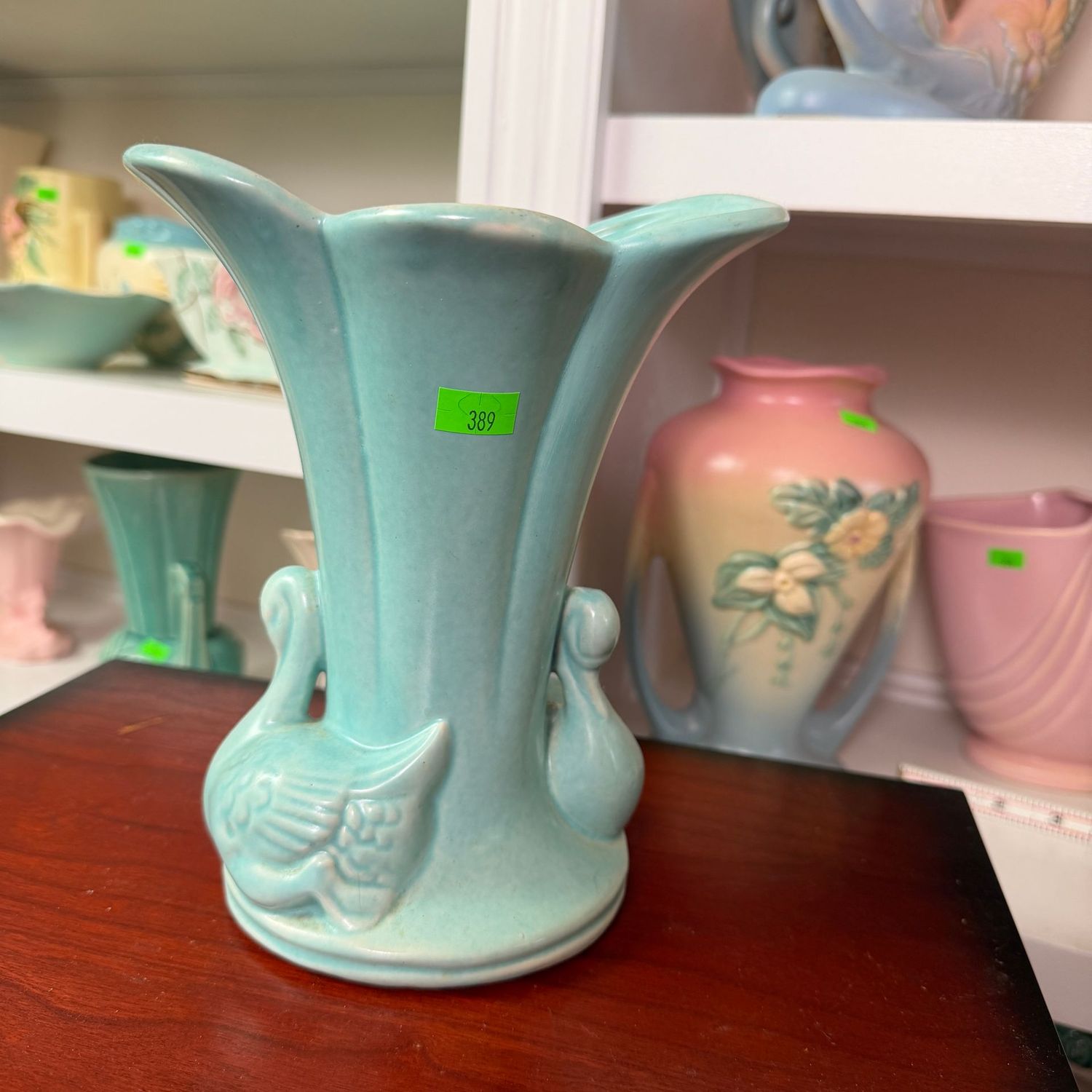 Lot #389, teal double-swan pottery vase, 7 Lot #389, teal double-swan pottery vase, 7"