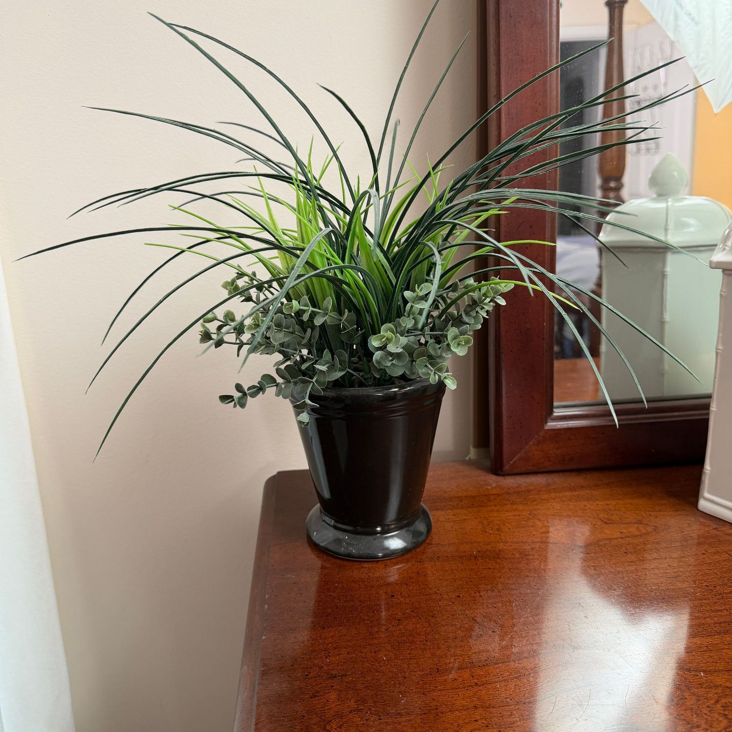 Black planter with faux grass & succulent arrangement, 11"