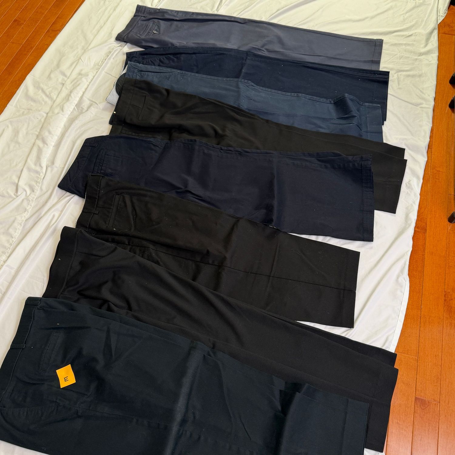 Pants Lot E,  8 pair of black & brown pants (varying lengths) (one needs a new button) size 14, & 14 short