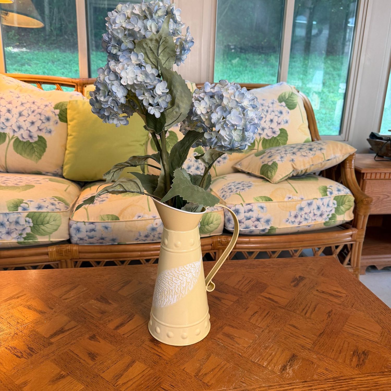 Yellow metal pitcher with blue hydrangea arrangement, pitcher is 12 Yellow metal pitcher with blue hydrangea arrangement, pitcher is 12"H