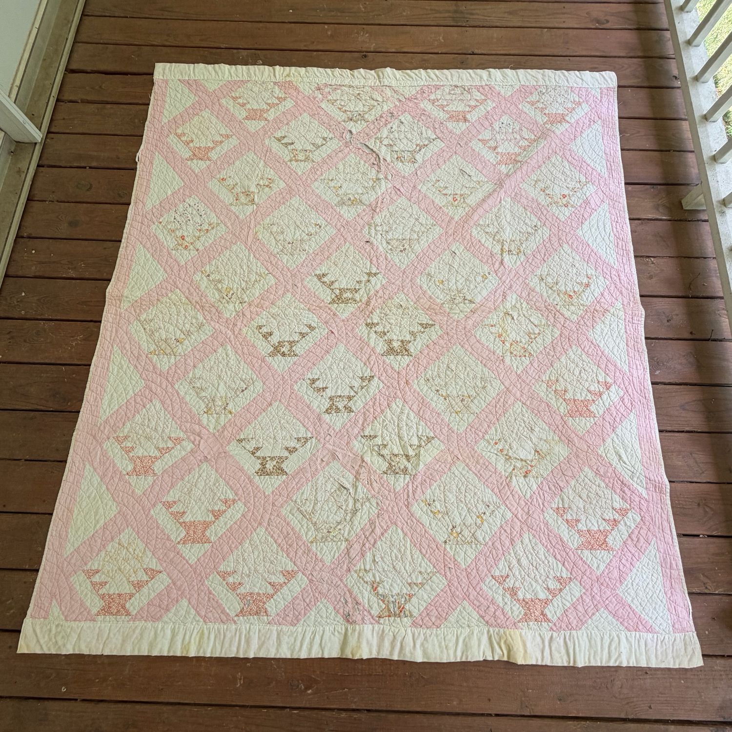 Pink and white basket-pattern, antique quilt, some spots, thinness, and a few tears, 6'6 Pink and white basket-pattern, antique quilt, some spots, thinness, and a few tears, 6'6" x 5'10"