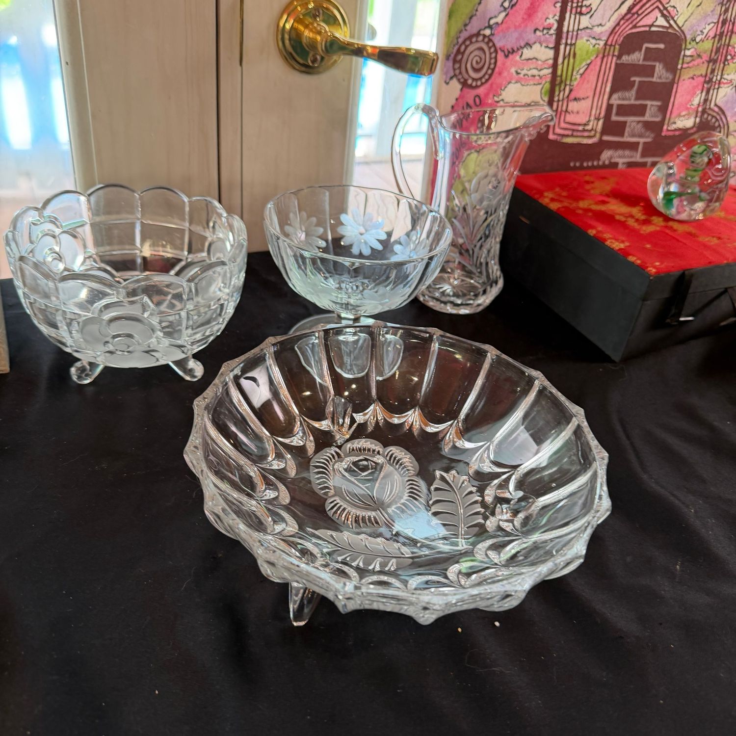 Group of floral clear glass, crystal small pitcher, compote, bowls, the largest bowl is 9 Group of floral clear glass, crystal small pitcher, compote, bowls, the largest bowl is 9"W