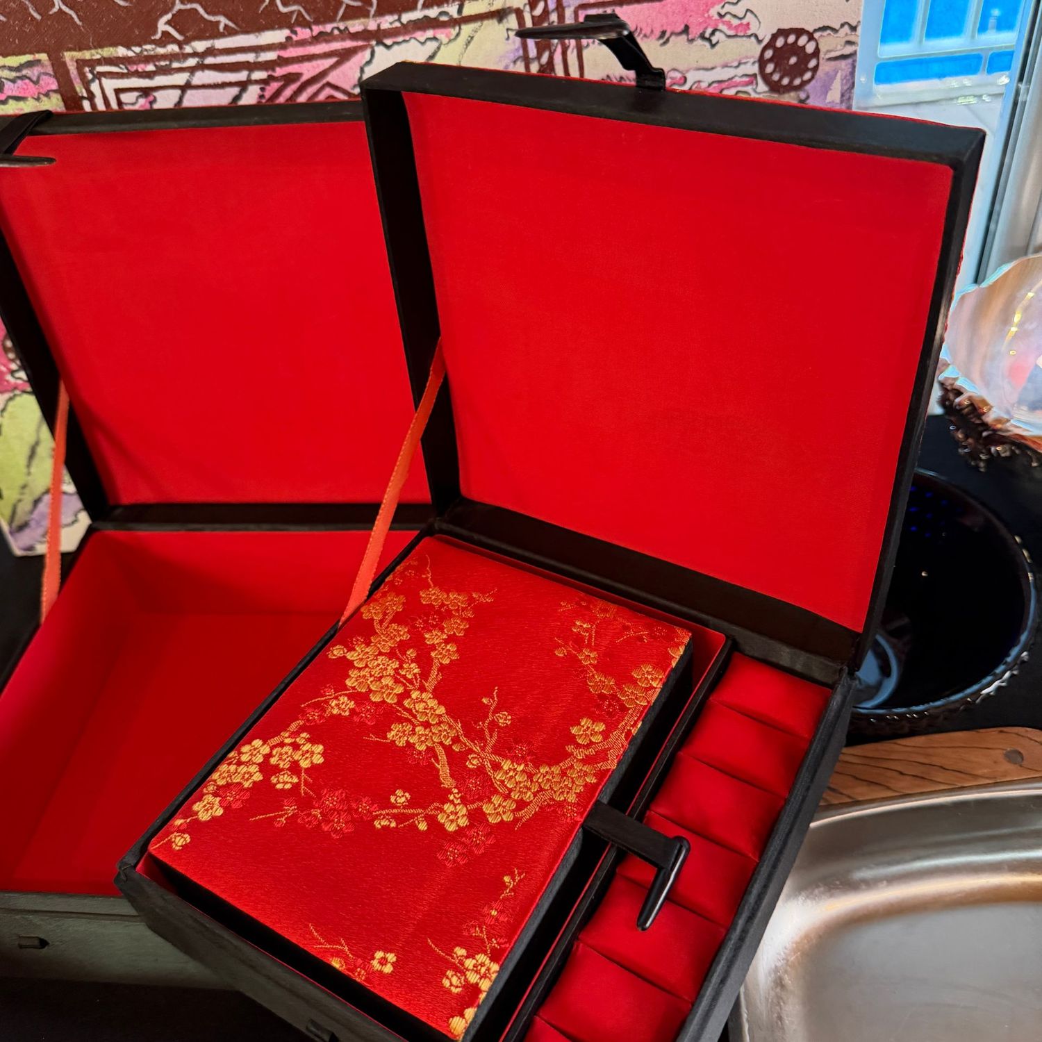 Three nesting red and black fabric jewelry boxes, the largest is 12 Three nesting red and black fabric jewelry boxes, the largest is 12" x 10"
