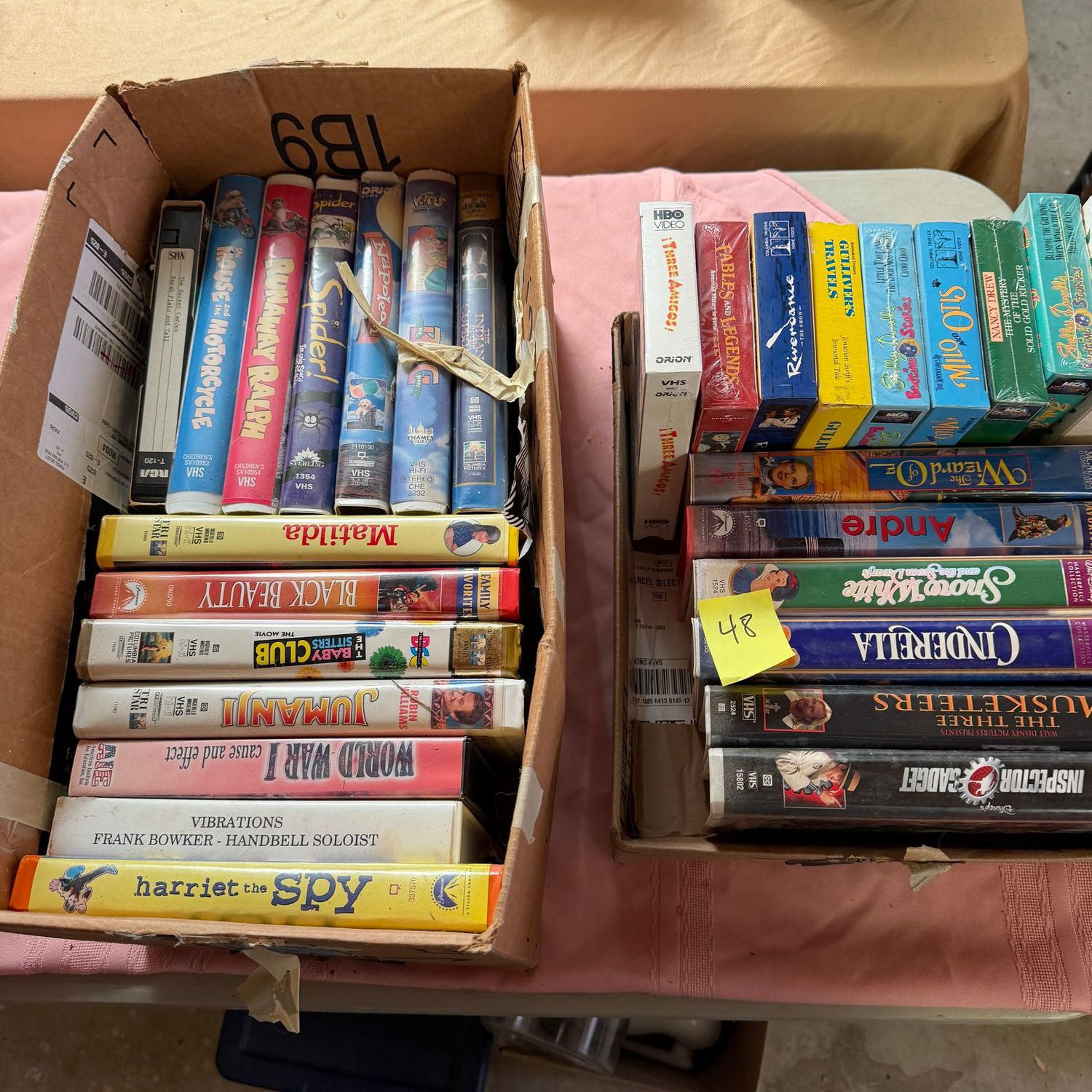 Lot #48, 2 small boxes filled with VHS tapes Lot #48, 2 small boxes filled with VHS tapes