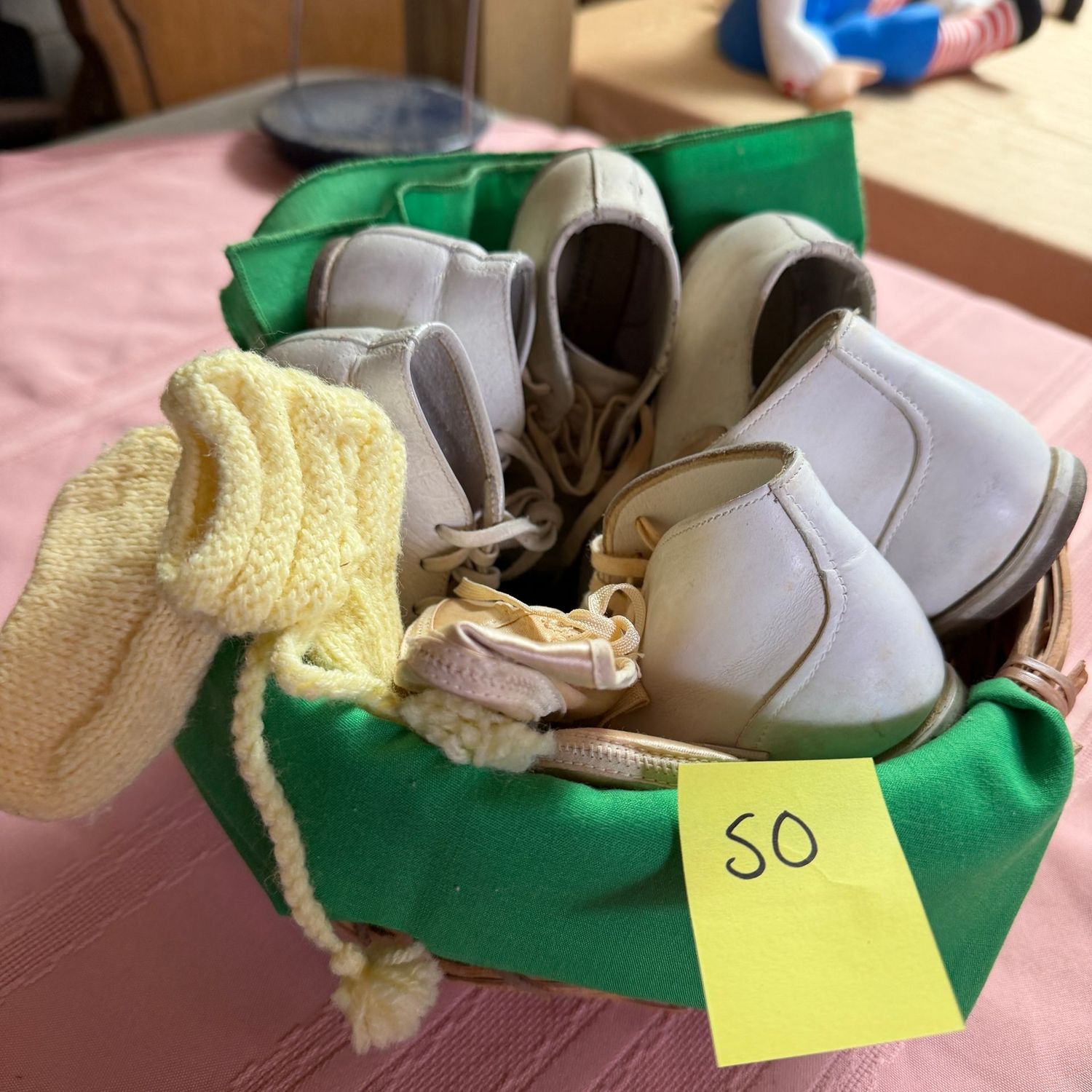 Lot #50, basket of vintage baby shoes Lot #50, basket of vintage baby shoes