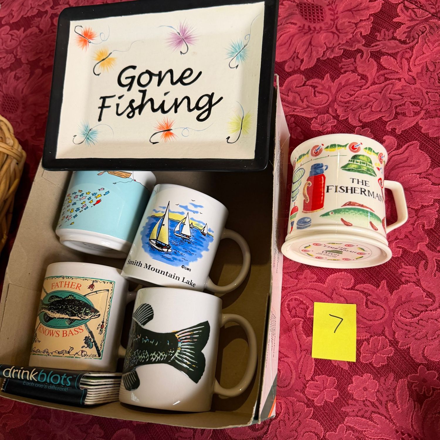Lot #7, group of fishing-themed mugs and dish