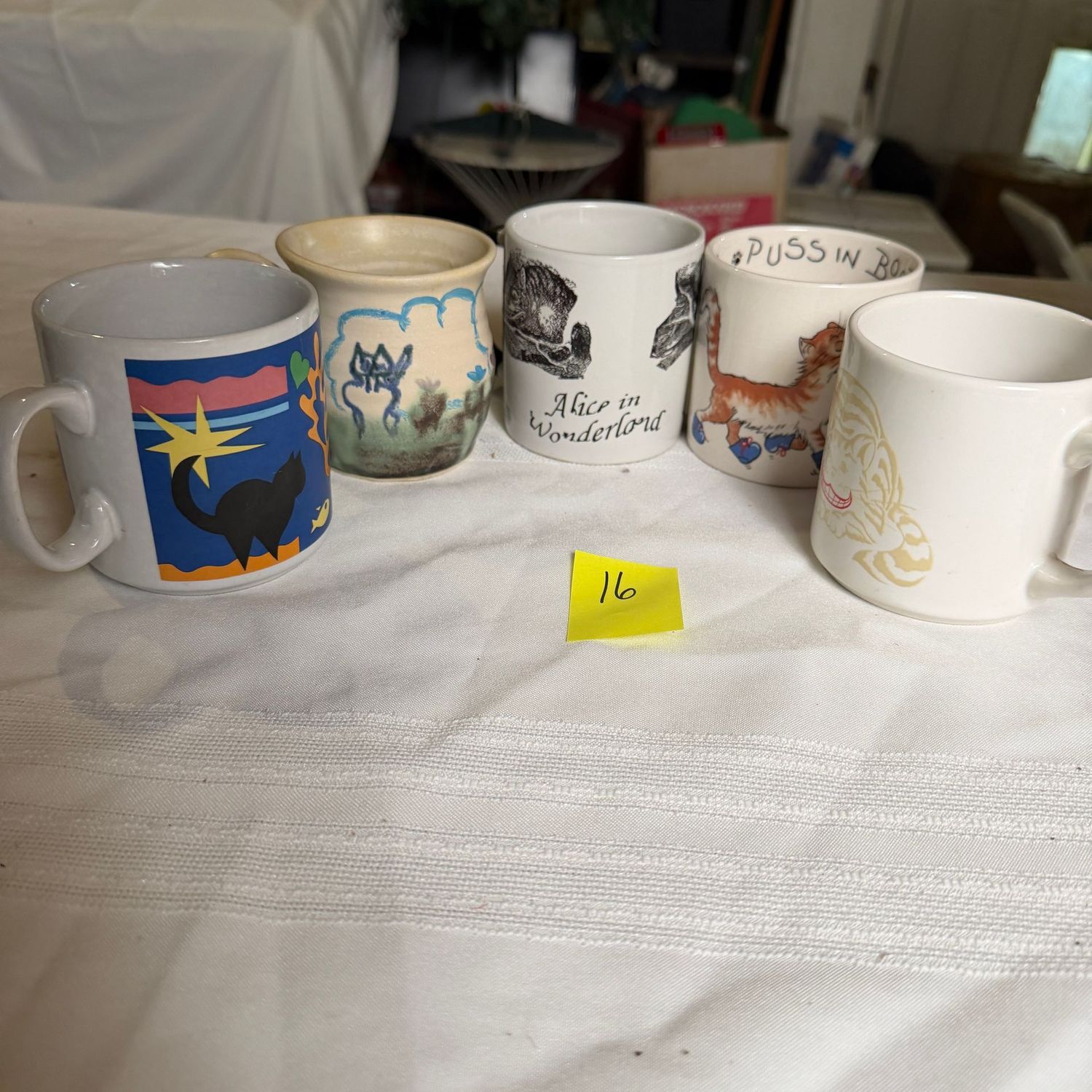 Lot #16, group of mugs, cat-themed Lot #16, group of mugs, cat-themed