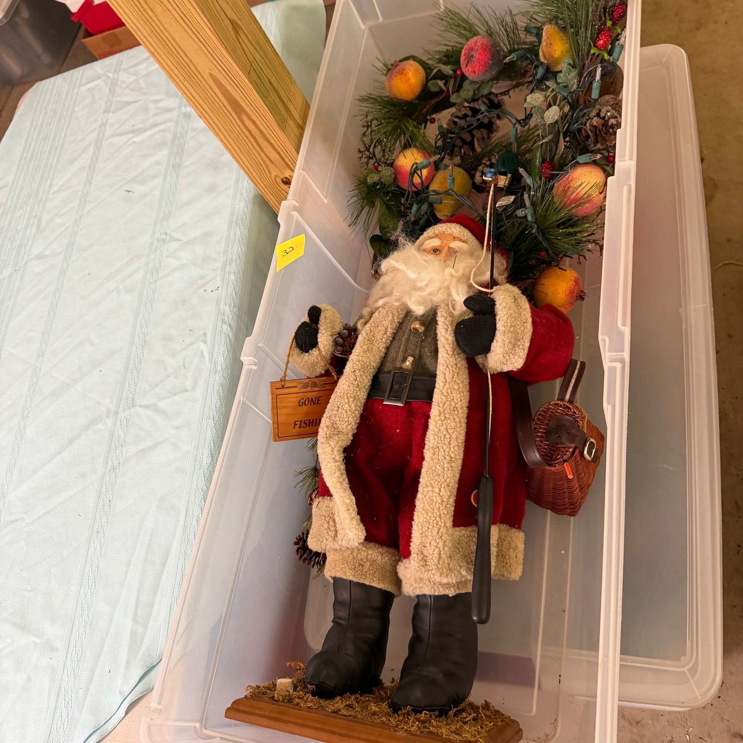 Lot #32, long bin with sugared fruit small garland, tall rustic fishing Santa Lot #32, long bin with sugared fruit small garland, tall rustic fishing Santa