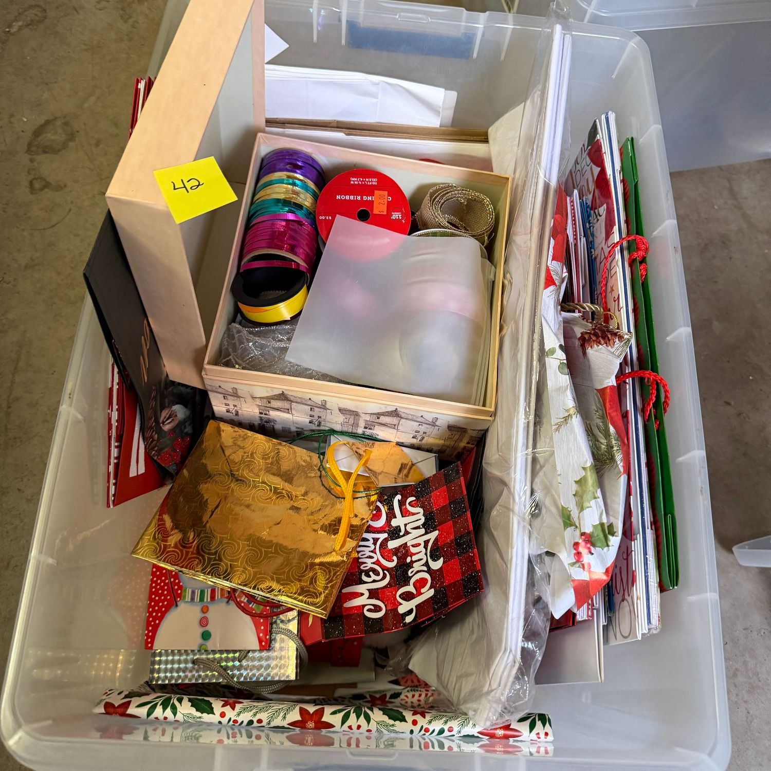 Lot #42, bin with wrapping supplies Lot #42, bin with wrapping supplies