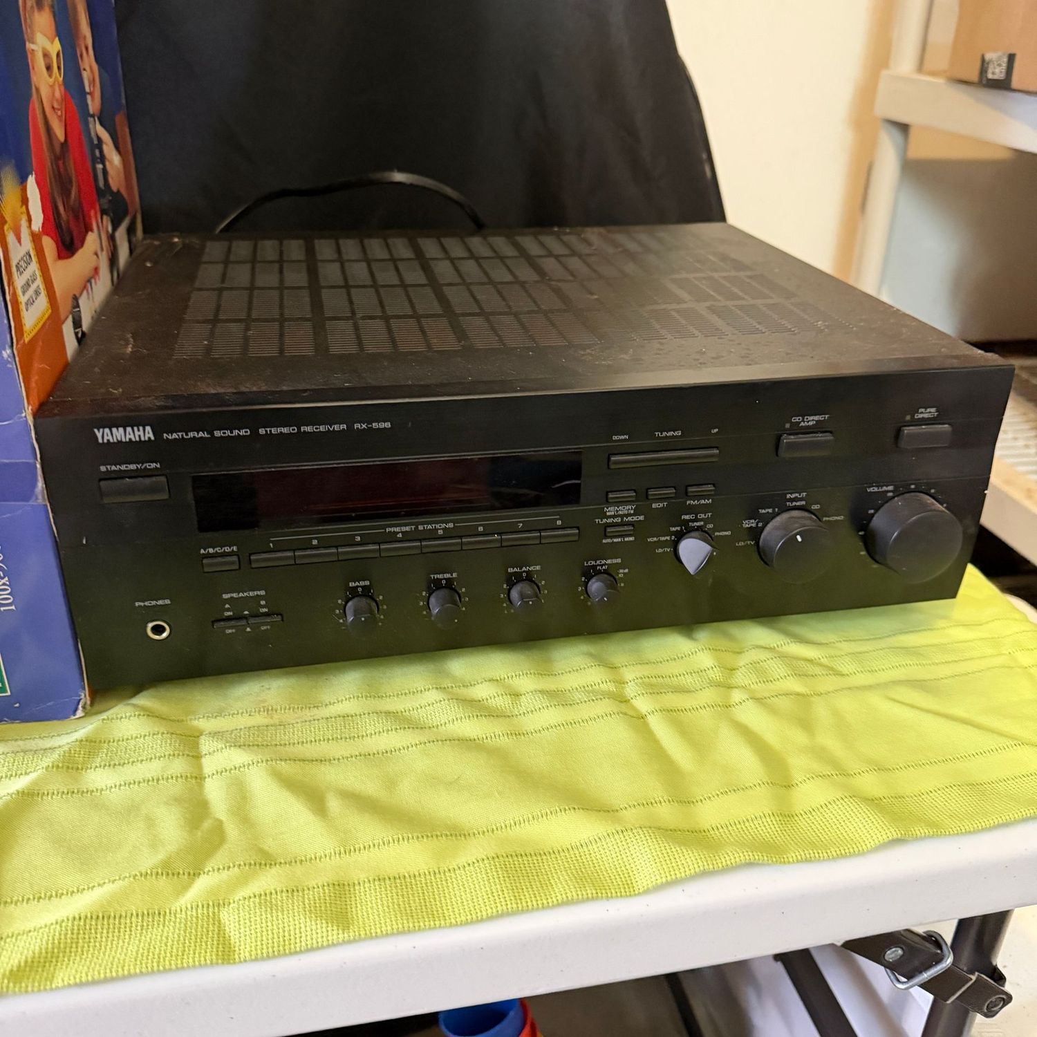 Yamaha Natural Sound Stereo Receiver RX-596, powers on quickly, and appears in good condition, not tested